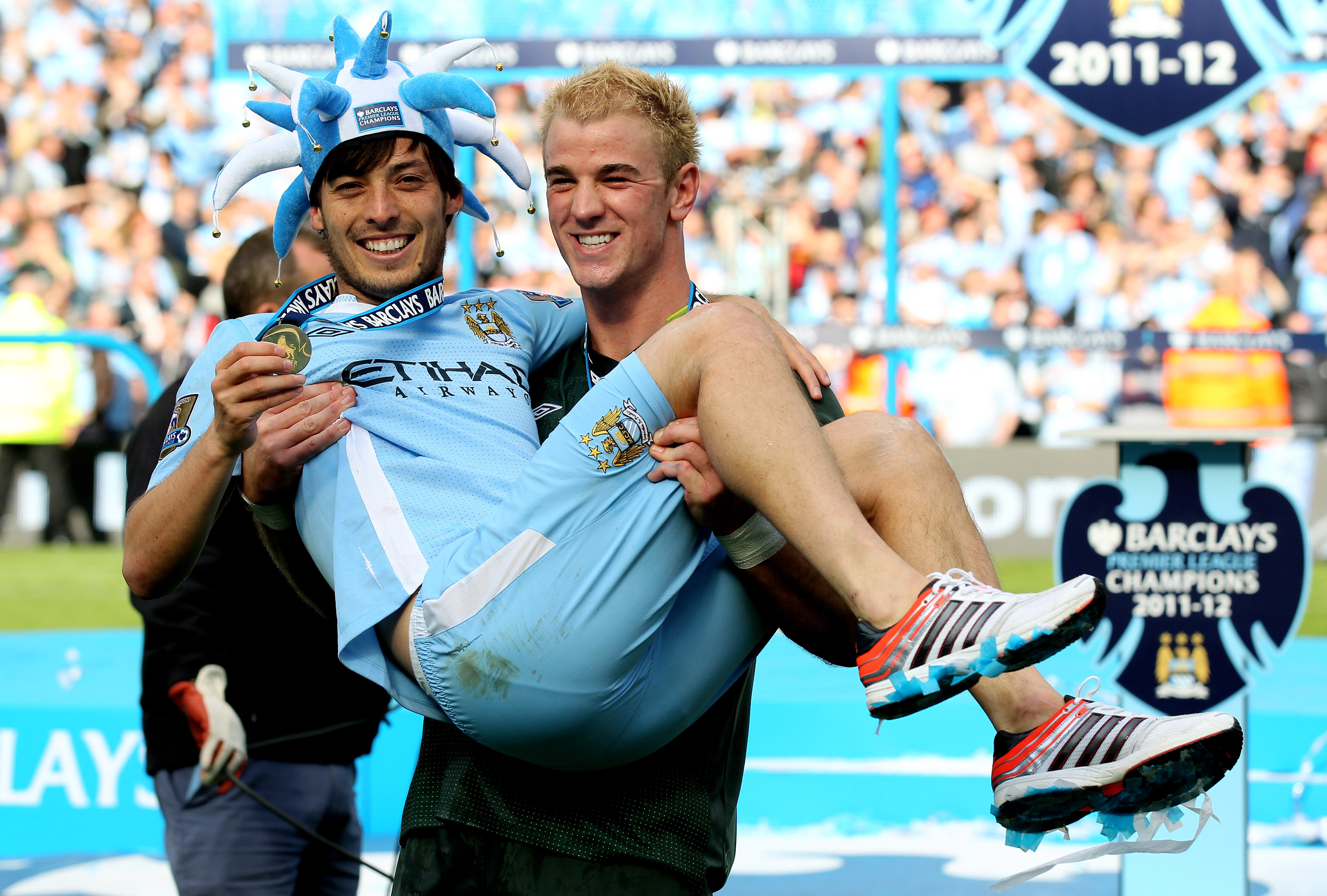 Joe Hart and David Silva celebrate after winning the 2011/12 title (Getty)