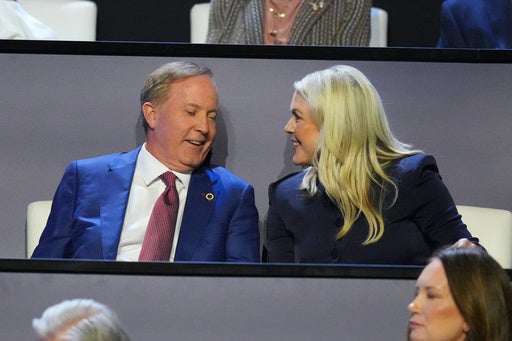Paxton speaks with former White House press secretary Karoline Leavitt at the Republican convention (AP)