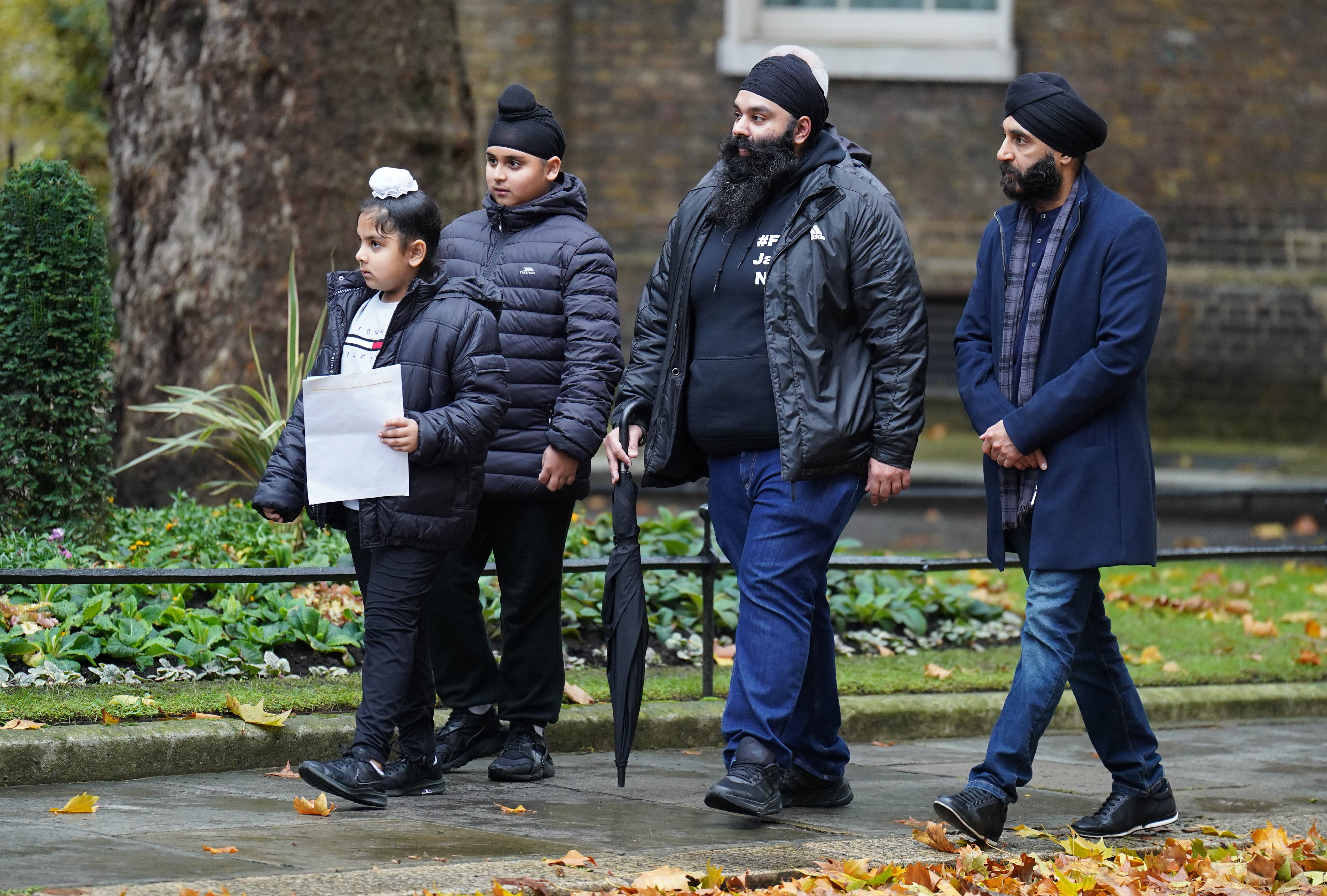 Members of the Free Jaggi Now Campaign hand in a petition to 10 Downing Street, London, in 2022. (PA)