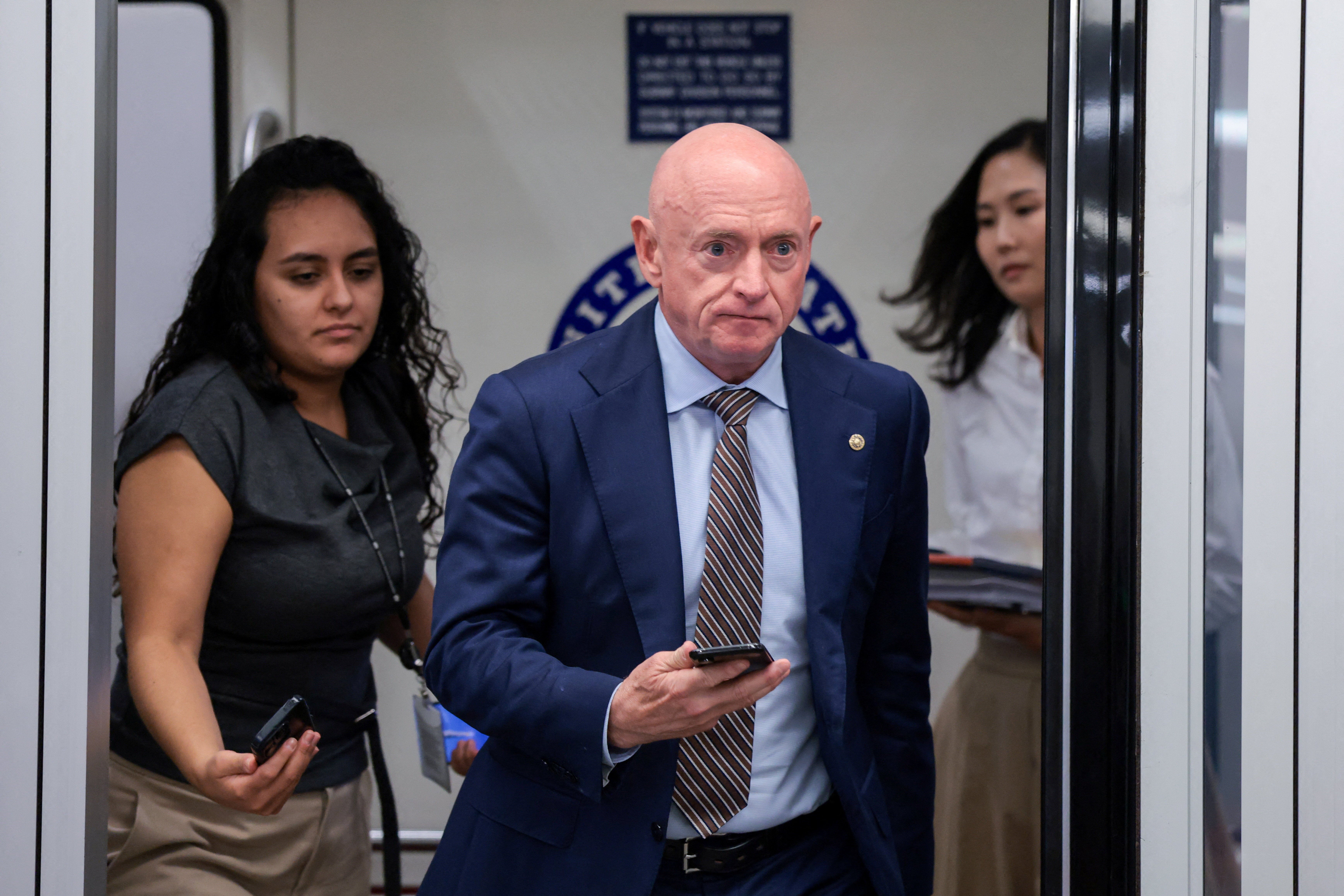 Sen. Mark Kelly (D-Ariz.) said Trump was not being serious about AI oversight (Reuters)