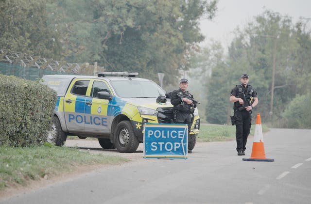 Armed police at a checkpoint near RAF Fairford in Gloucestershire (Ben Birchall/PA)