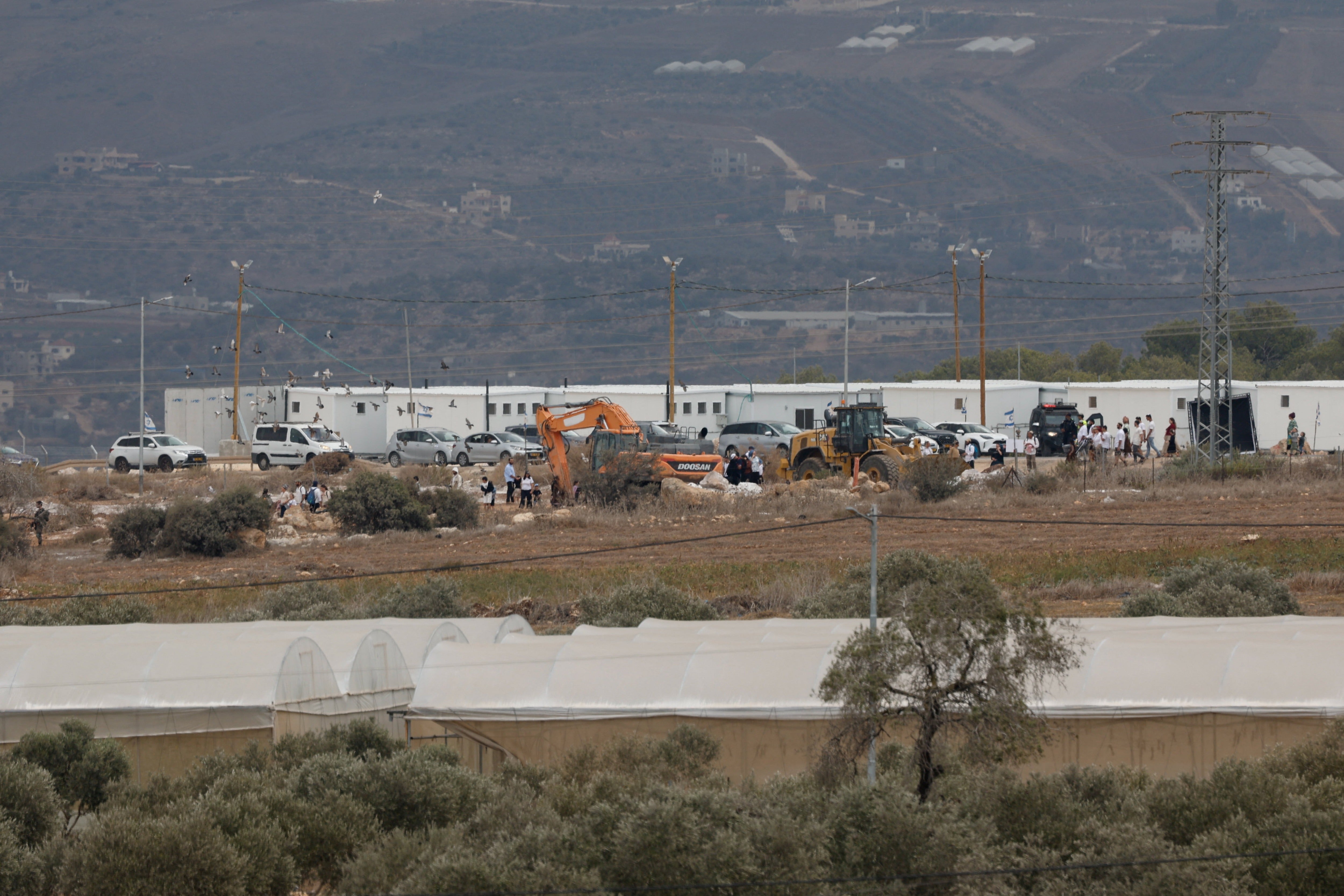 Israeli settlers shoot two Palestinians in the West Bank, killing one
