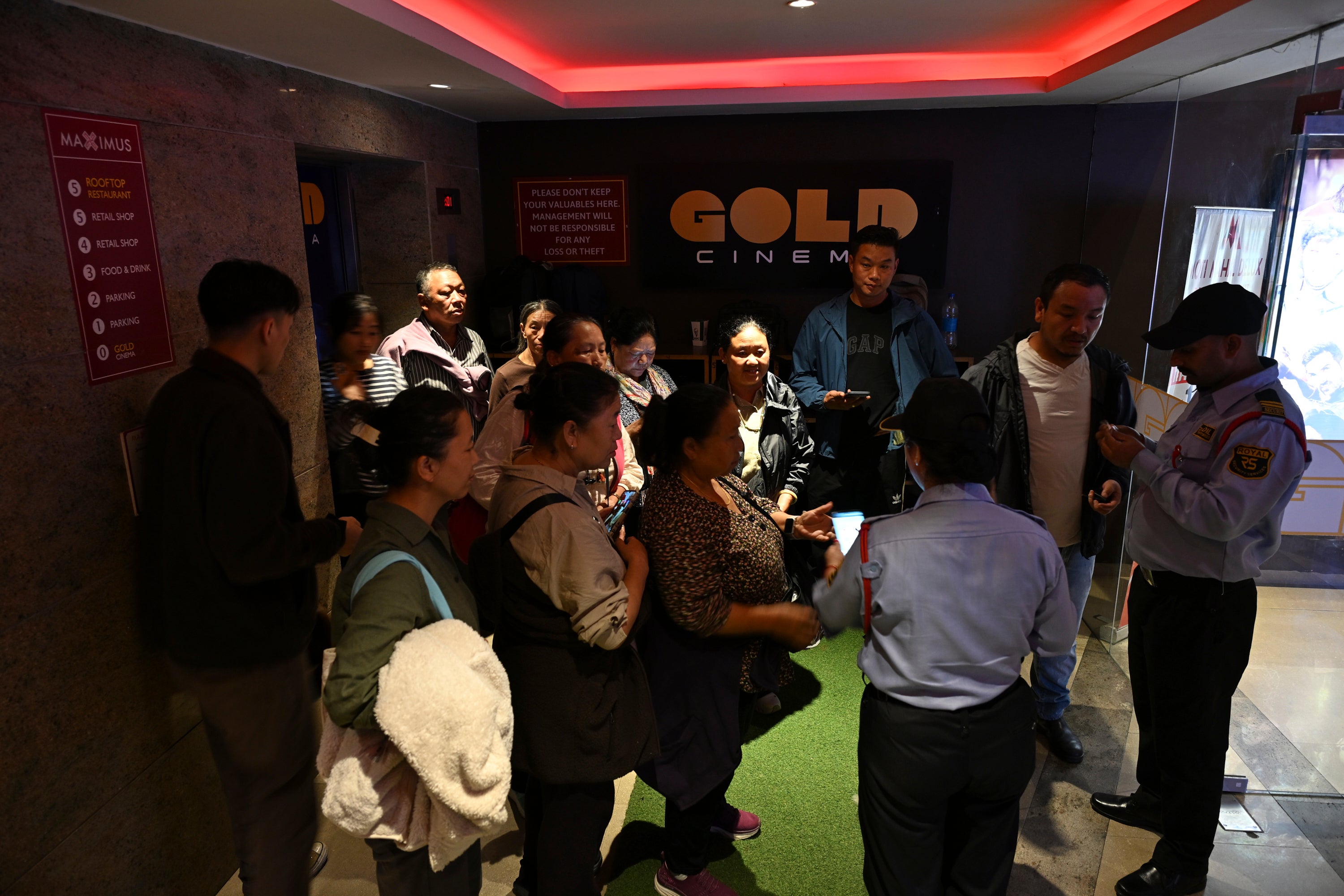 People gather at a movie theatre to watch Four Rivers Six Ranges, a historical drama about resistance fighters who helped the Dalai Lama escape Tibet in 1959, in Dharamshala, India, Thursday, oct. 1, 2026. (AP Photo/Tenzin Lekmon)