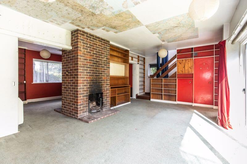 The property has been altered and extended over the years, with additions including a kitchen, garden room, store and integral garage