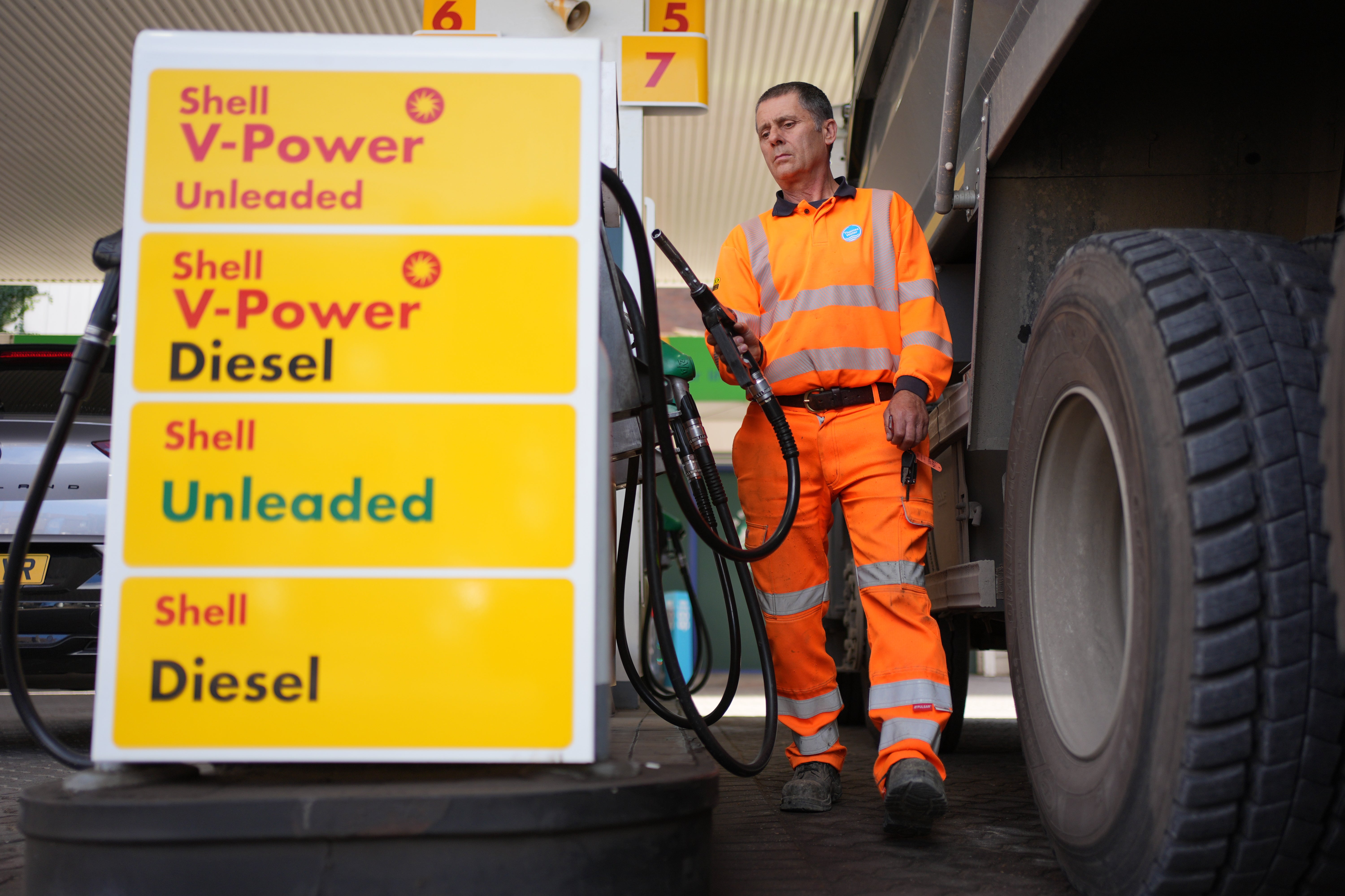 A Thames Water employee fills his lorry with diesel at 207.9p per litre at a petrol station in London (PA)