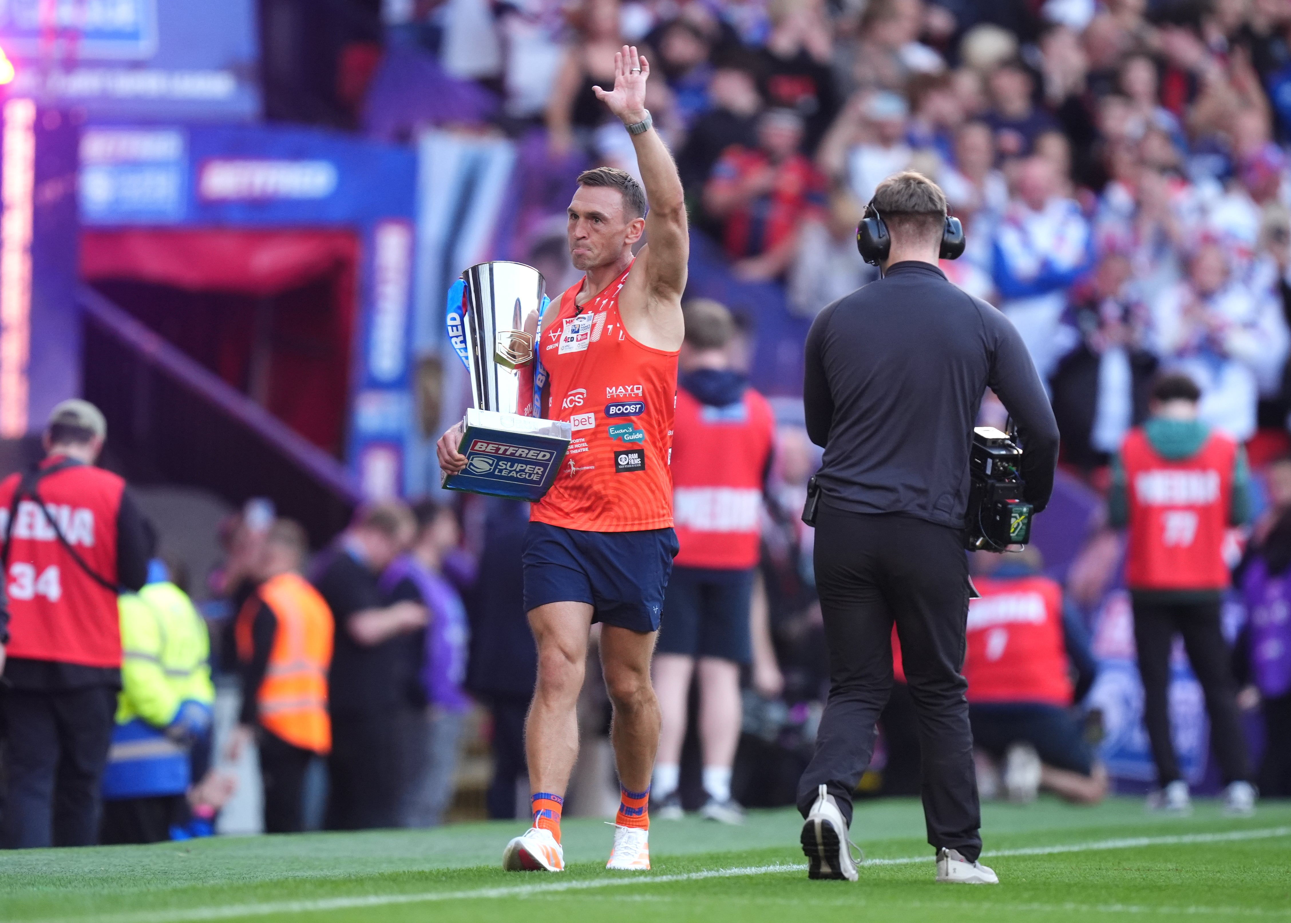 Sir Kevin Sinfield brings out the trophy ahead of the Betfred Super League Grand Final at Old Trafford (PA) (PA Wire)