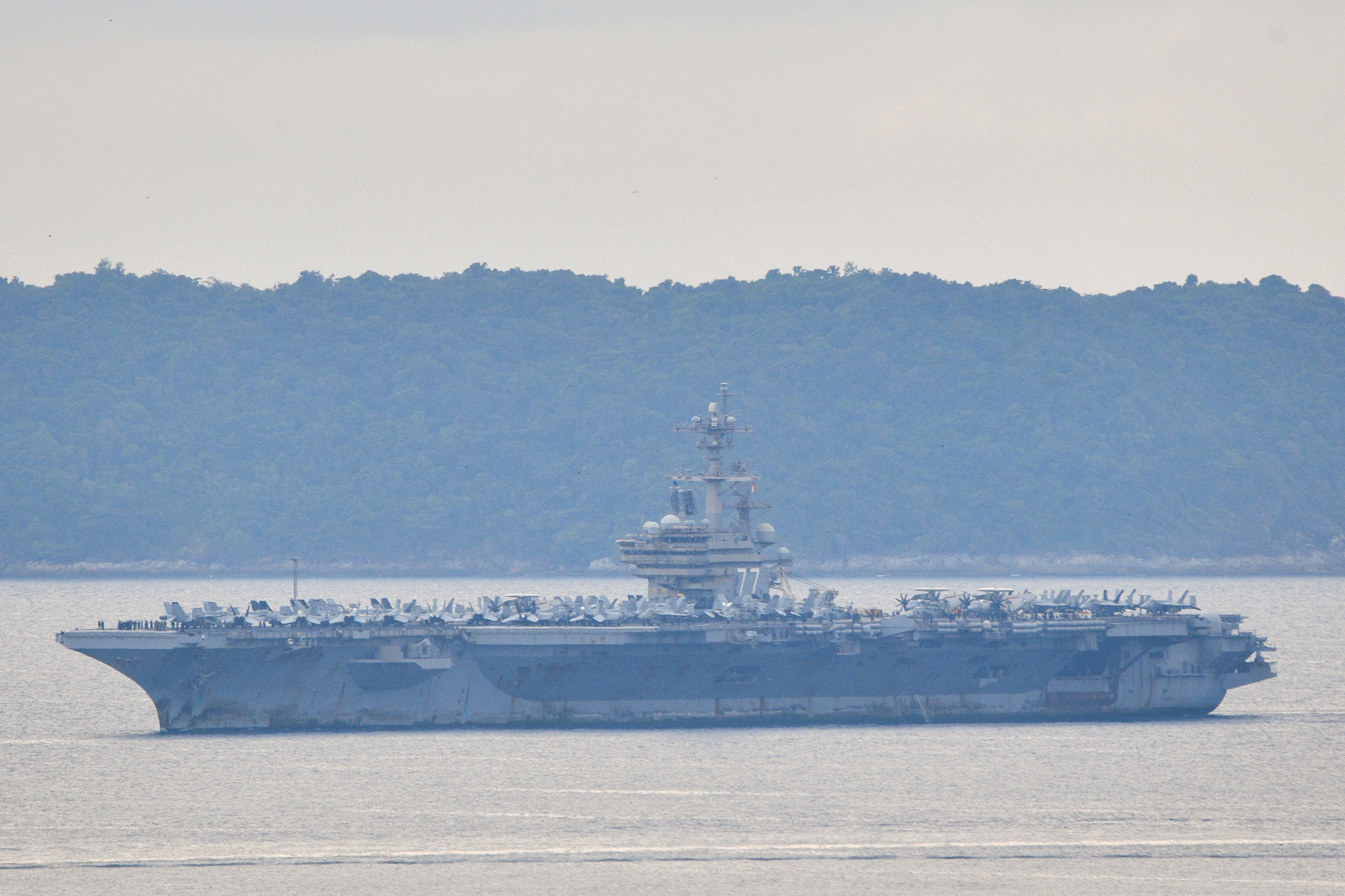 The USS George H.W. Bush arrives near Phuket Deep Sea Port before docking for a rest stop following a long deployment in the Middle East, in Phuket, Thailand, October 4, 2026. (Reuters)