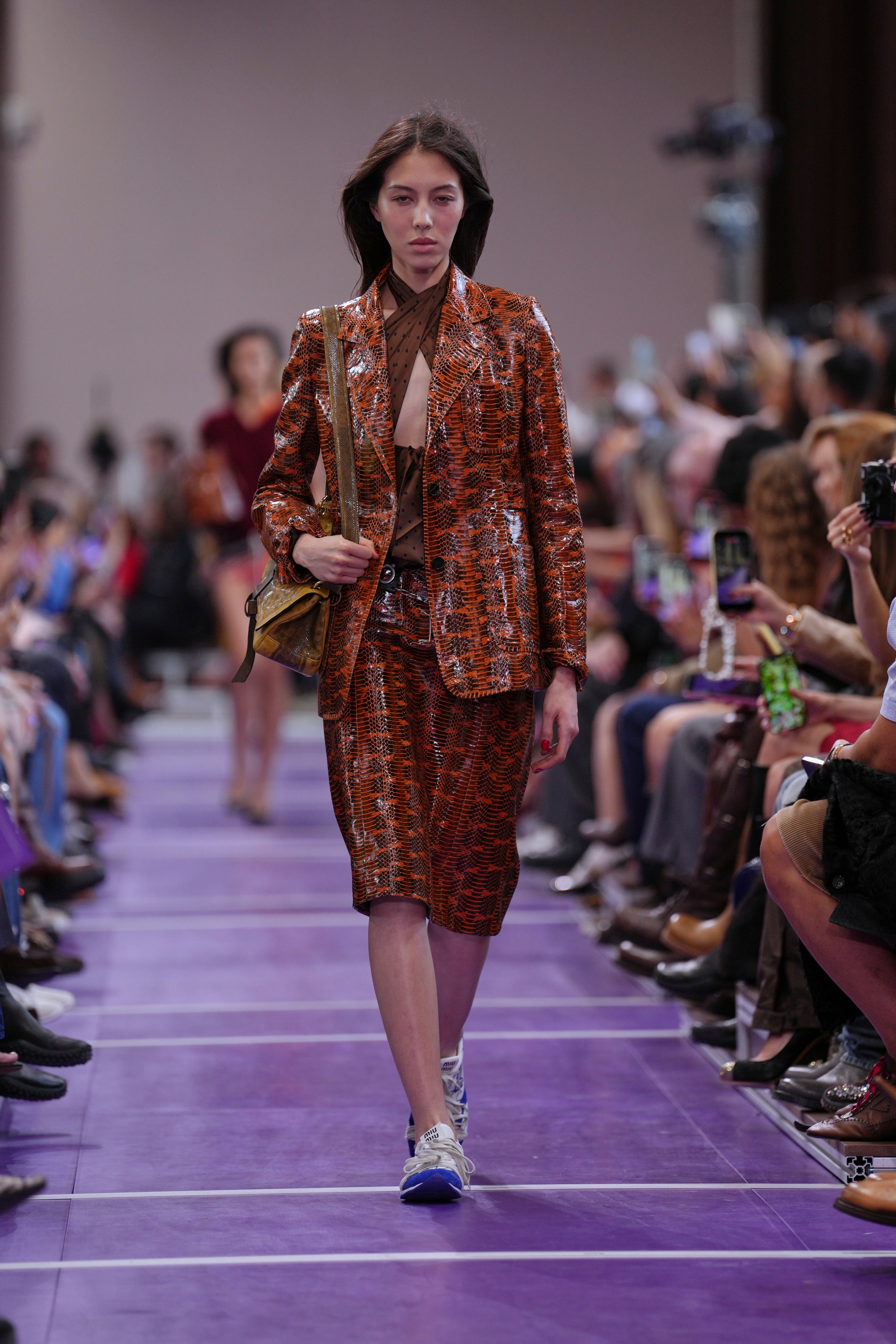 Leather skirt suits were prevalent throughout (Aurelien Morissard/AP)