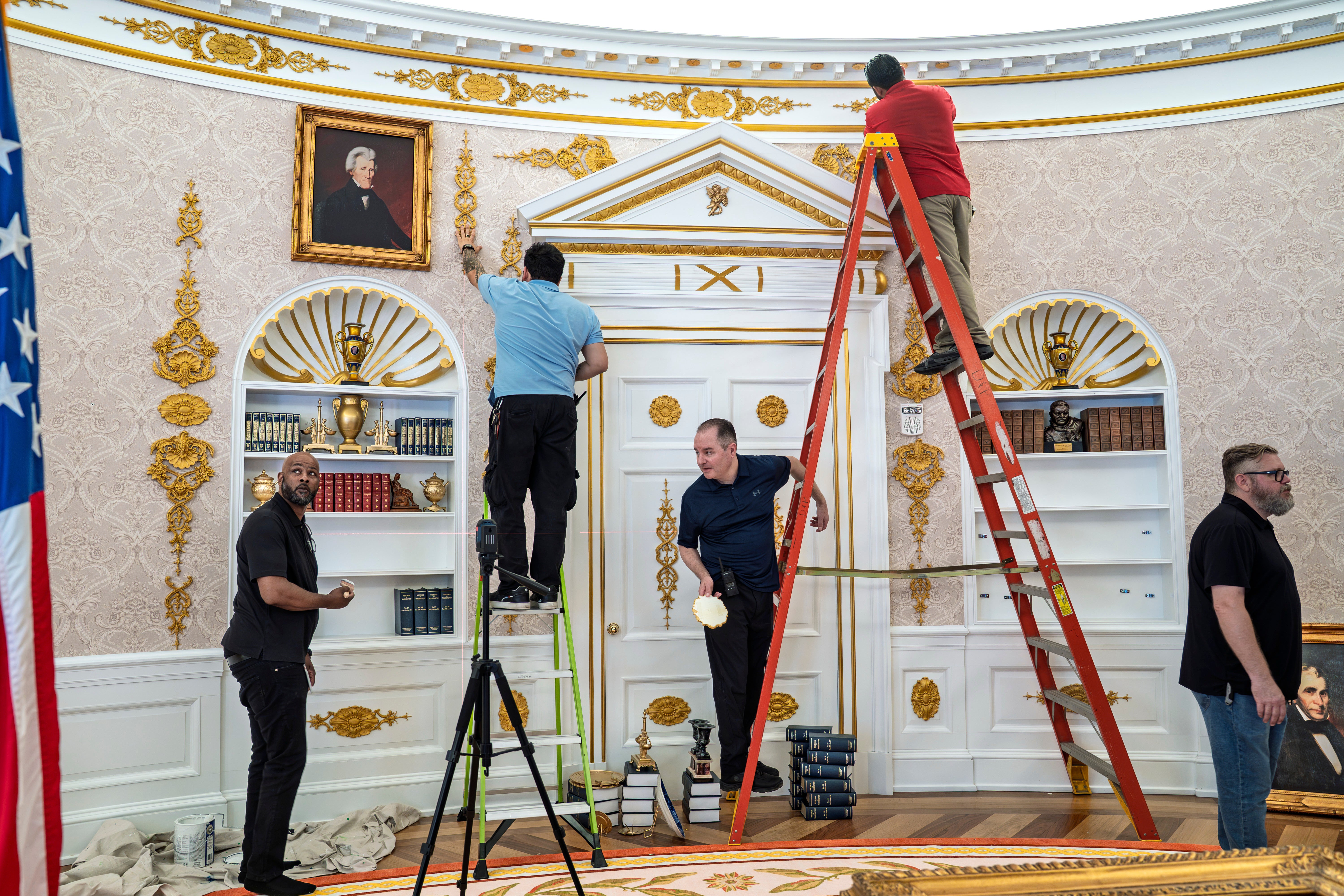 A replica of President Donald Trump's Oval Office is updated to the current decor by workers at "The People's House: A White House Experience," in Washington, Friday, Oct. 2, 2026. (AP Photo/J. Scott Applewhite)