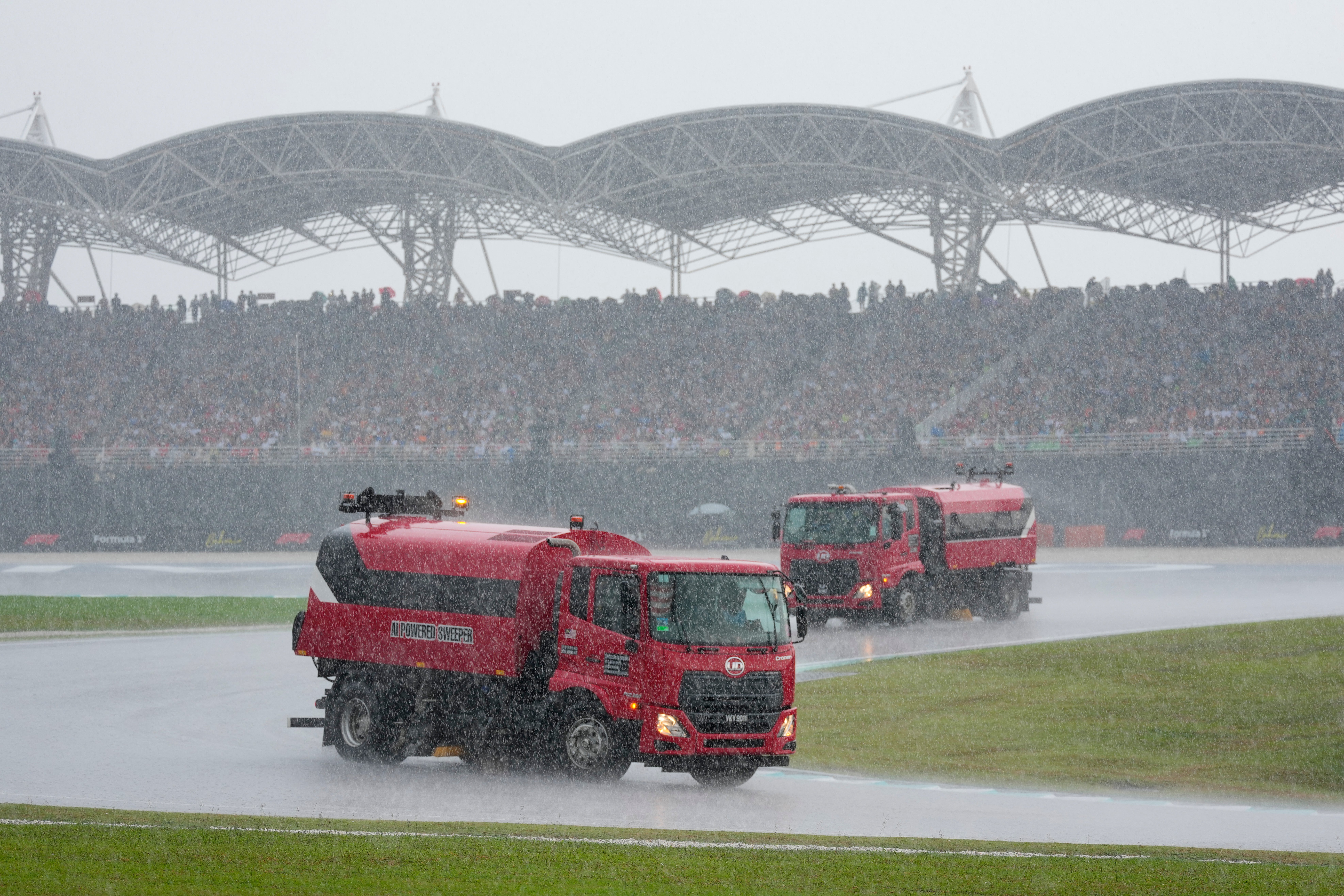 Heavy rain in Malaysia resulted in a delay to the race (AP Photo/Vincent Thian) (AP)
