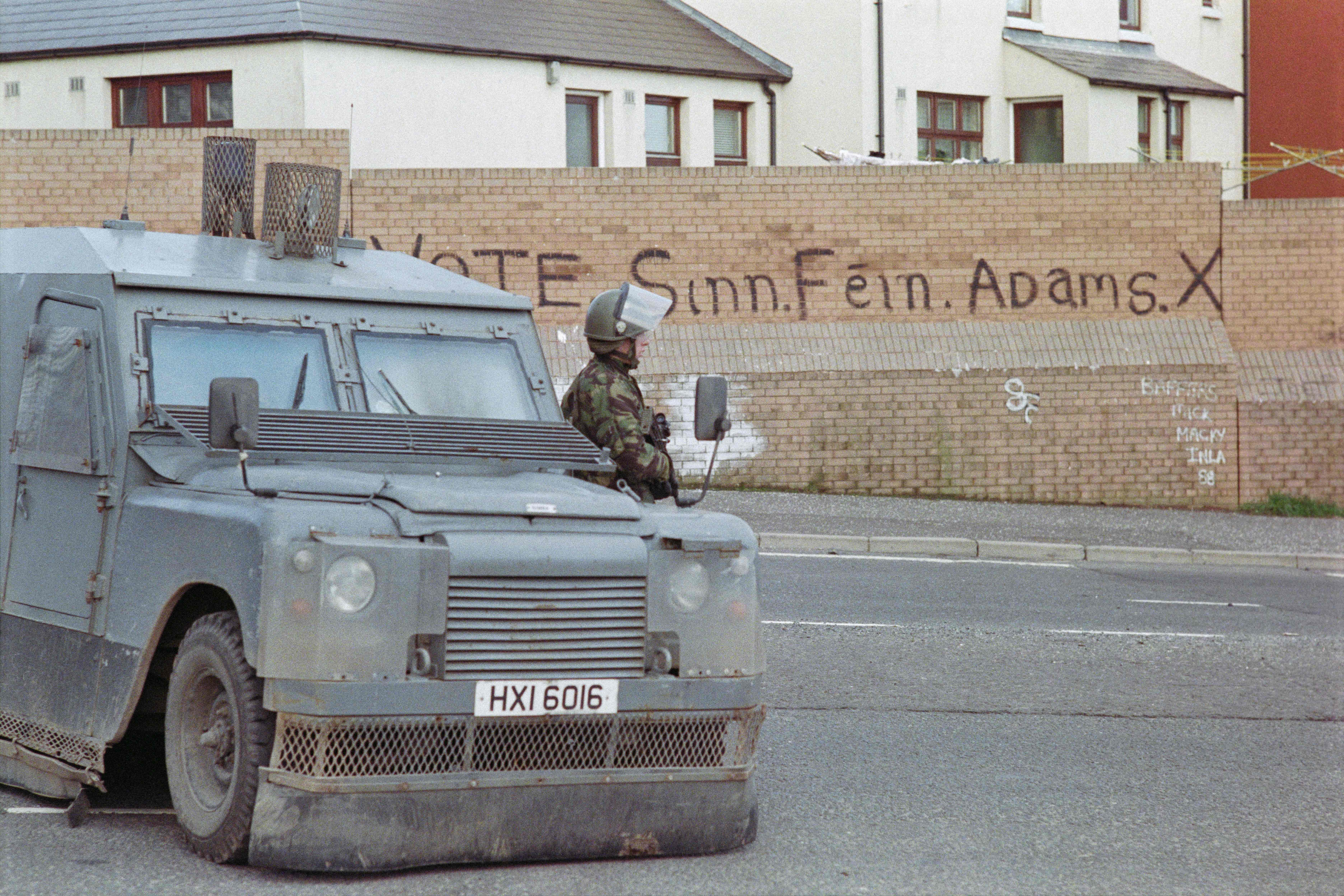 A soldier patrols in the republican district of Belfast, on 23 March 1988, Northern Ireland