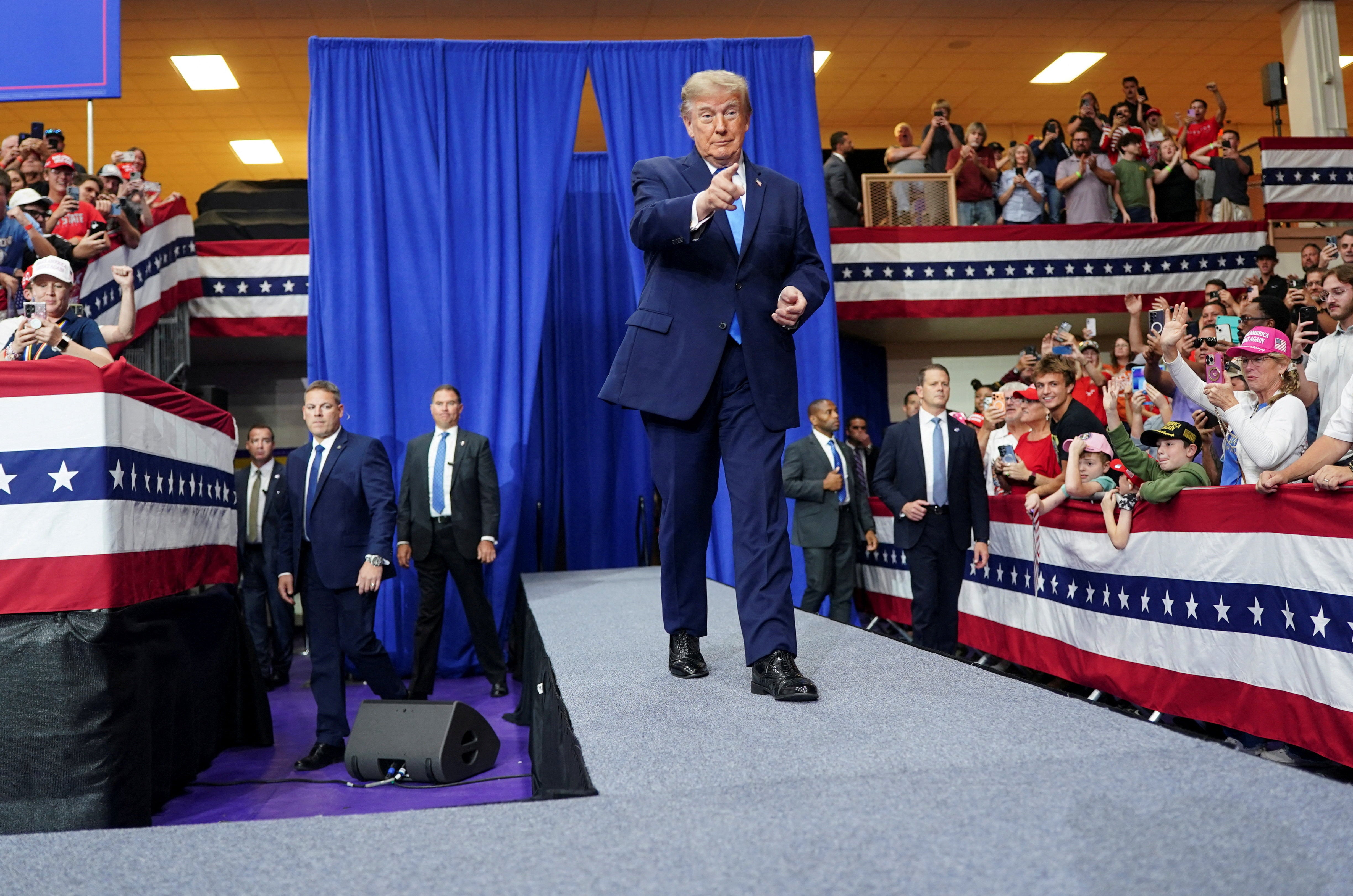 US President Donald Trump gestures as he walks during a rally at Butler High School in Vandalia, Ohio, US, October 3, 2026. REUTERS/Nathan Howard TPX IMAGES OF THE DAY