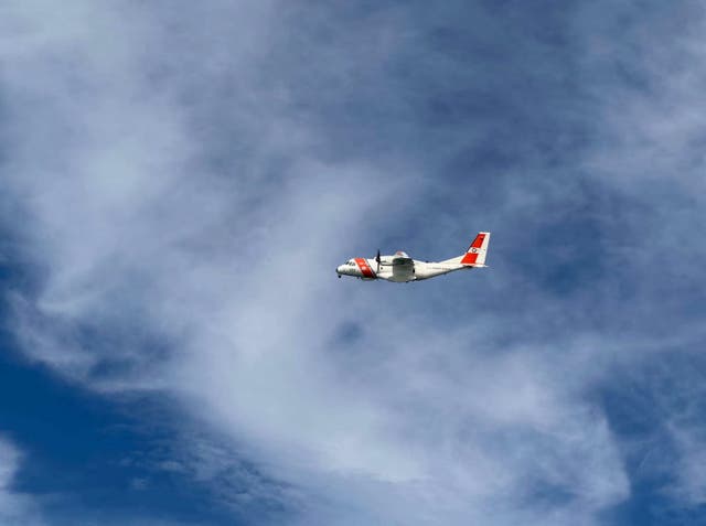A US Coast Guard plane searches for people after it found debris from a medical transport aircraft off the shore of Massachusetts' Nantucket island, US, October 3, 2026