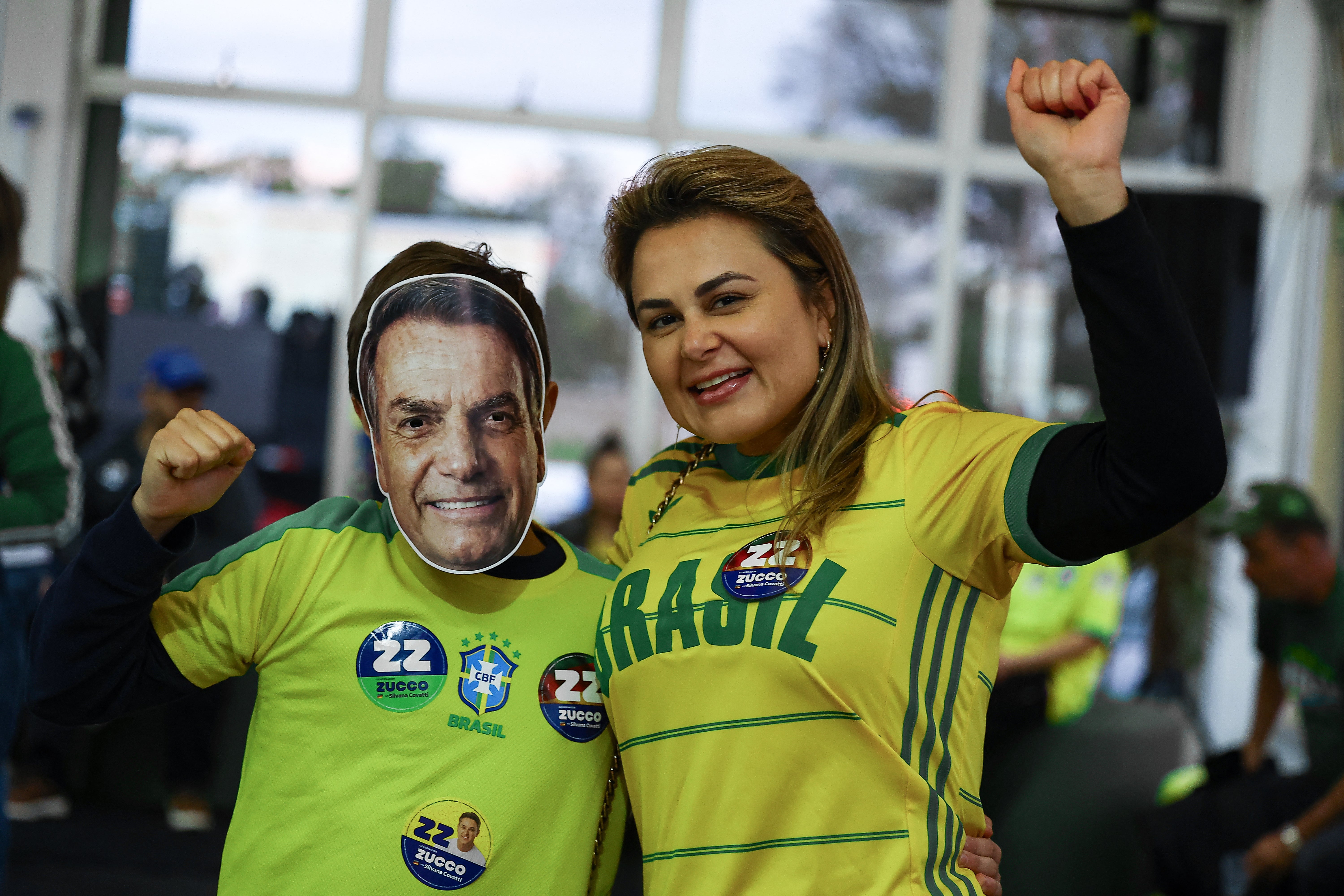 Supporters of Brazil's presidential candidate Flavio Bolsonaro react as they wait for the first results in Porto Alegre on 4 October 2026