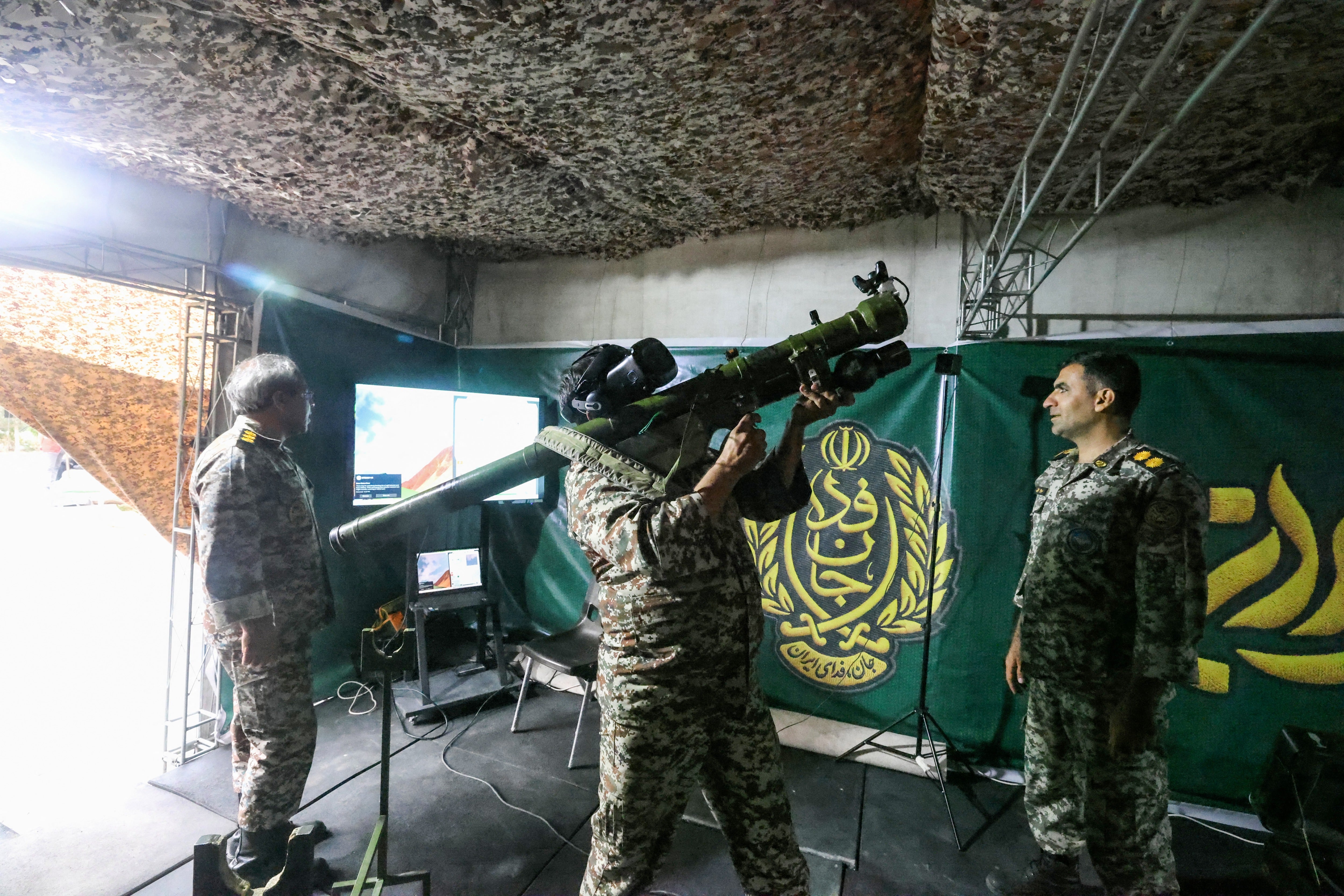 An Iranian officer demonstrates the use of a man-portable air-defense system during the inauguration of the training centre