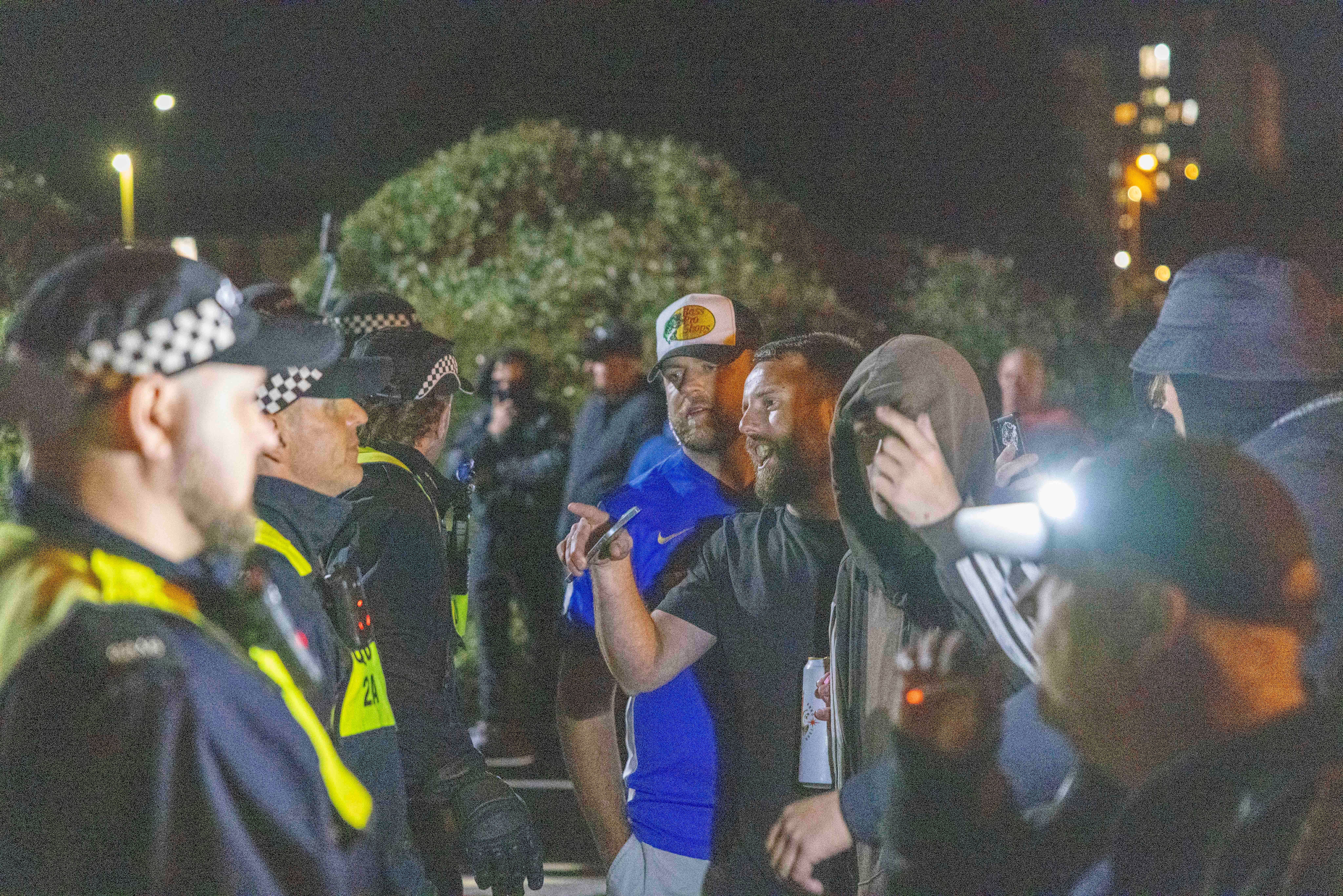 Police and demonstrators during an anti-migrant protest in Gosport