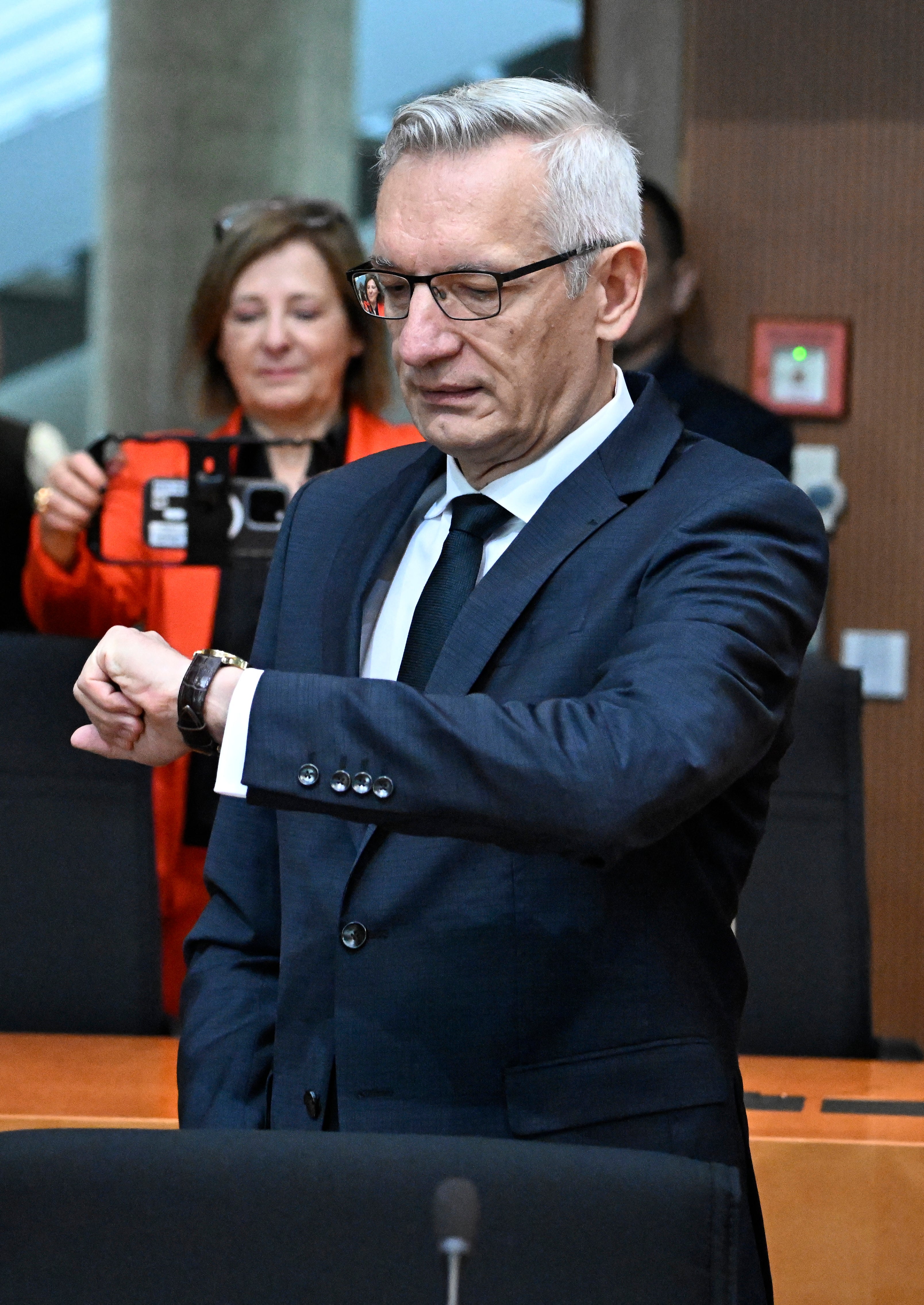 President of the Federal Intelligence Service (Bundesnachrichtendienst, BND) Martin Jaeger checks his watch as he arrives for a hearing in front of a parliamentary committee, on October 5, 2026 in Berlin.