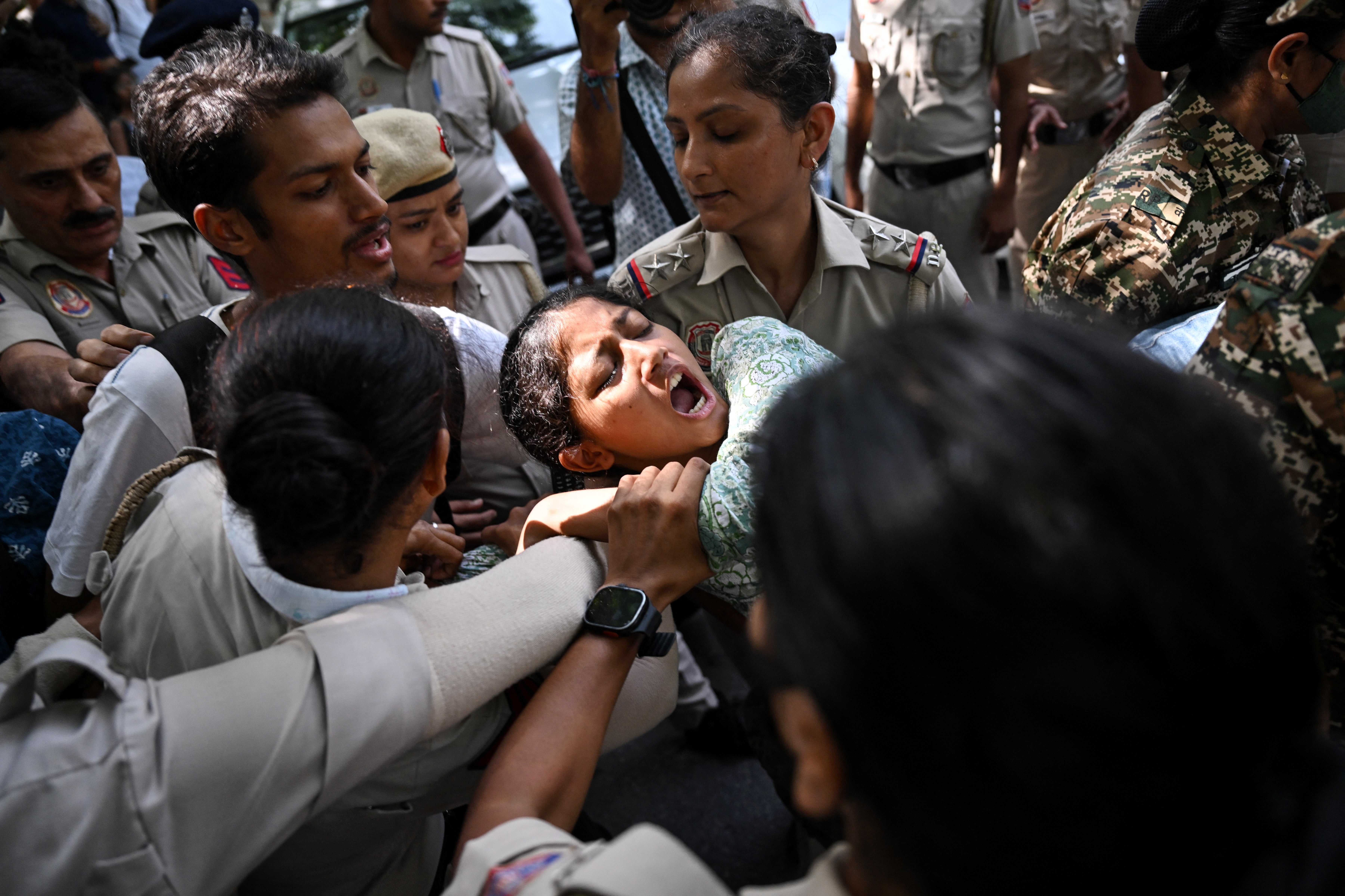 Police detain a protester during a demonstration against chief election commissioner Gyanesh Kumar in Delhi on 3 October 2026