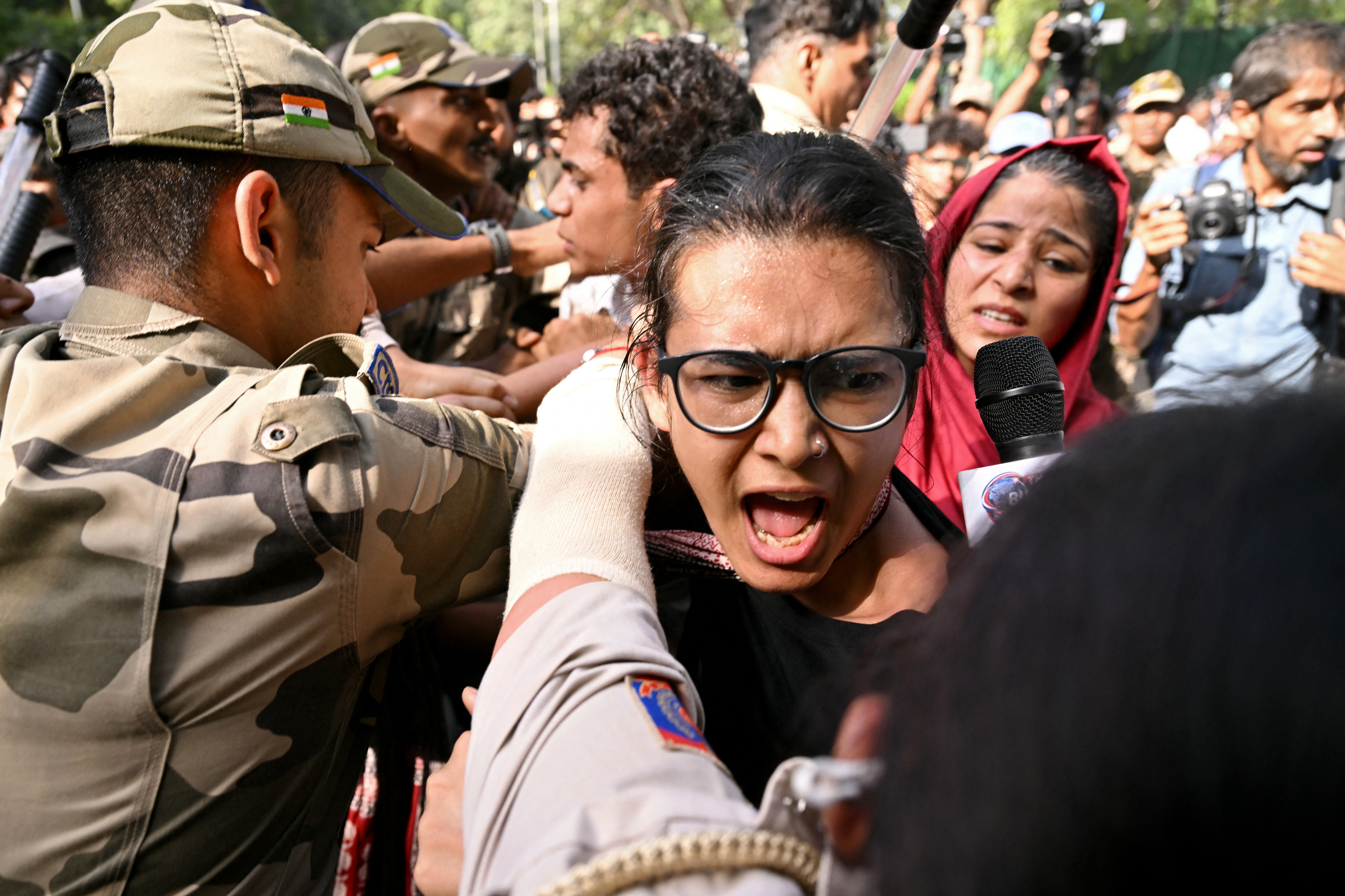 Police detain student leader Neha Bora during a protest against chief election commissioner Gyanesh Kumar in Delhi on 3 October 2026