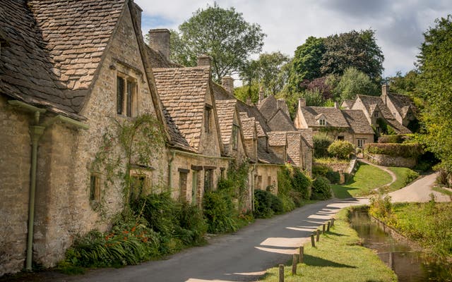 The famous line of cottages at Arlington Row in Bibury were restored and are owned by the National Trust