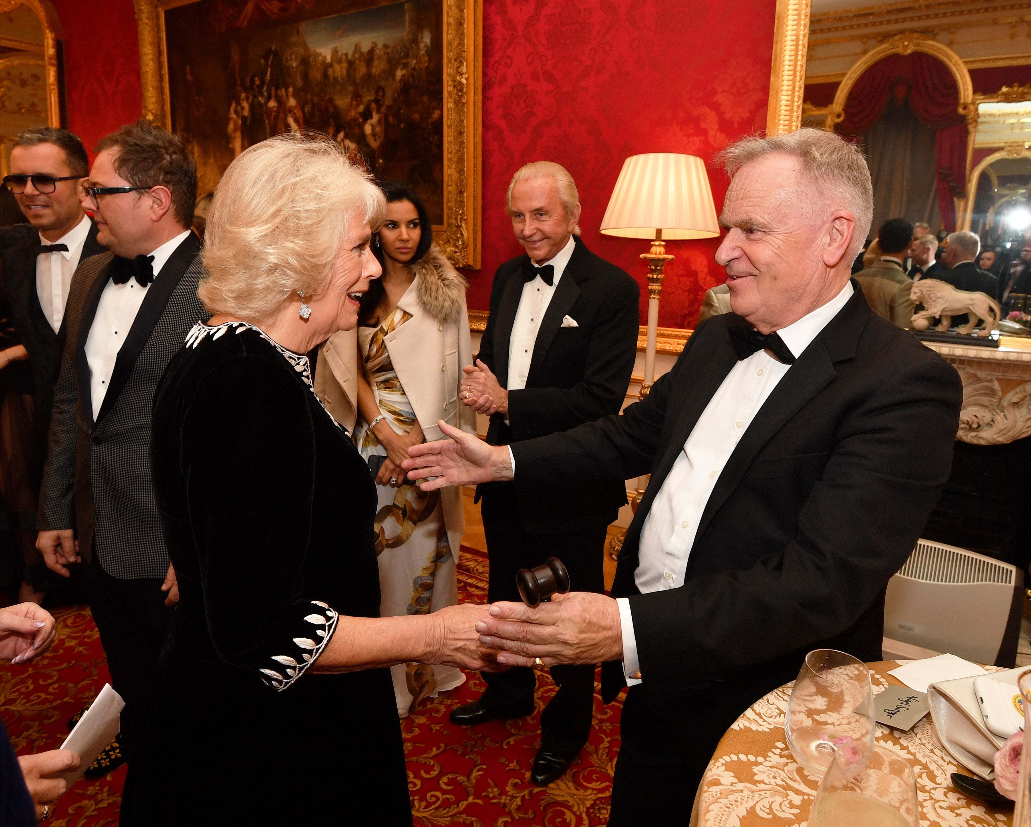 Lord Jeffrey Archer with the Duchess of Cornwall at the Julien Macdonald Fashion Show Reception at Lancaster House in London.