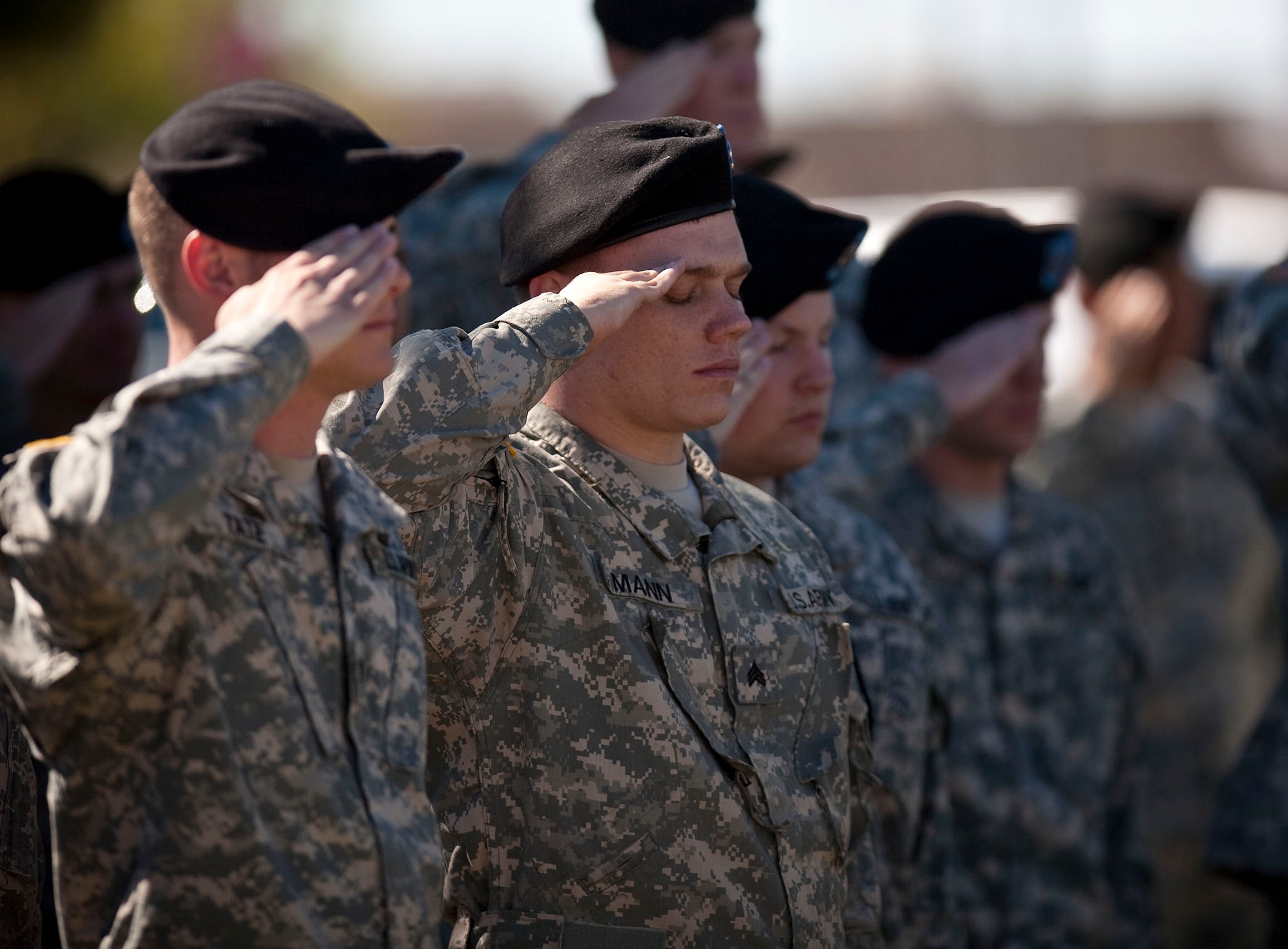 Soldiers salute at a remembrance service for Fort Hood victims on the first anniversary of the shooting in Killeen, Texas, on 5 November 2010
