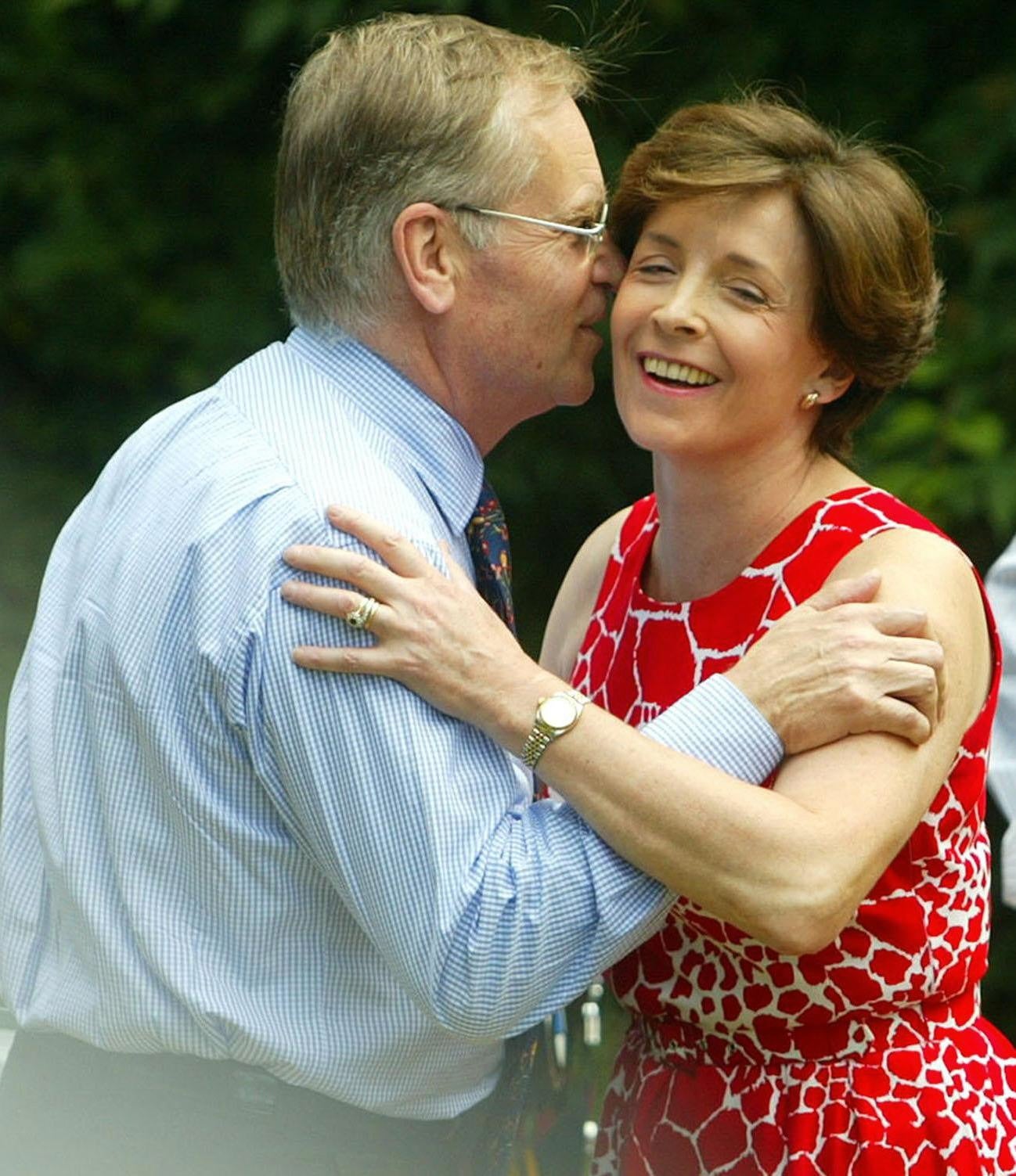 Lord Archer is greeted by his wife, Lady Archer, at their home at Grantchester, near Cambridge, following his release from Hollesley Bay open prison in Suffolk in July 2003.