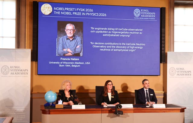 Eva Olsson, Ellen Moons, and Mark Pearce sit as they announce Francis Halzen as the recipient of the 2026 Nobel Prize in Physics
