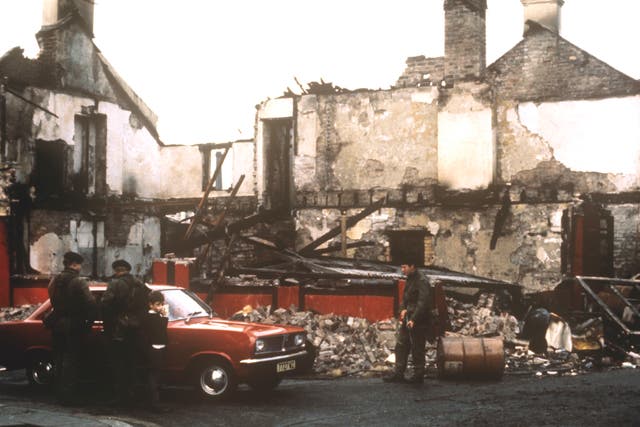 Troops check a car in Cupar Street in the Falls Road area of Belfast