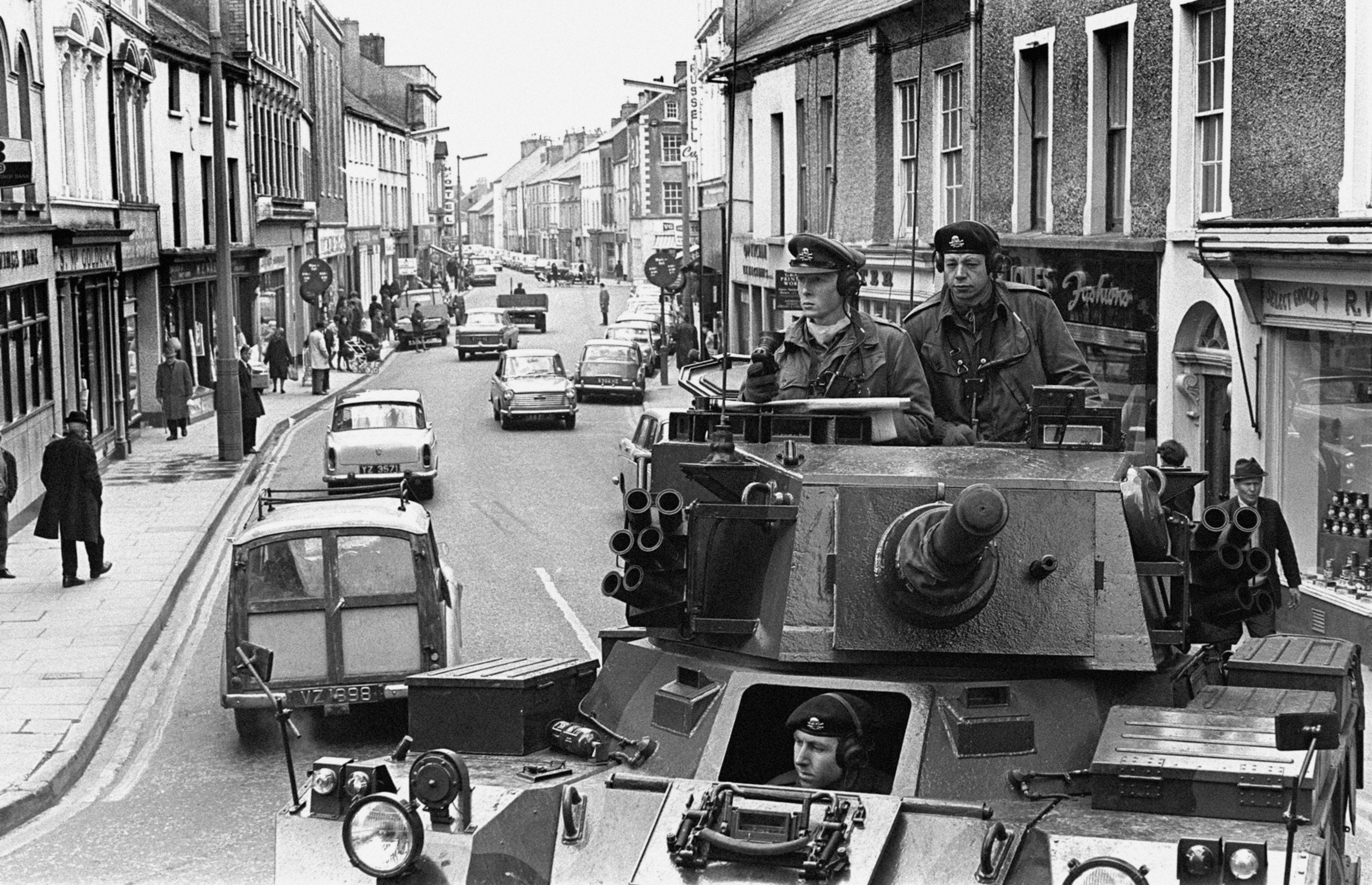 A British armoured car of the 17/21st Lancers moves through Strabane, Co Tyrone in April 1969