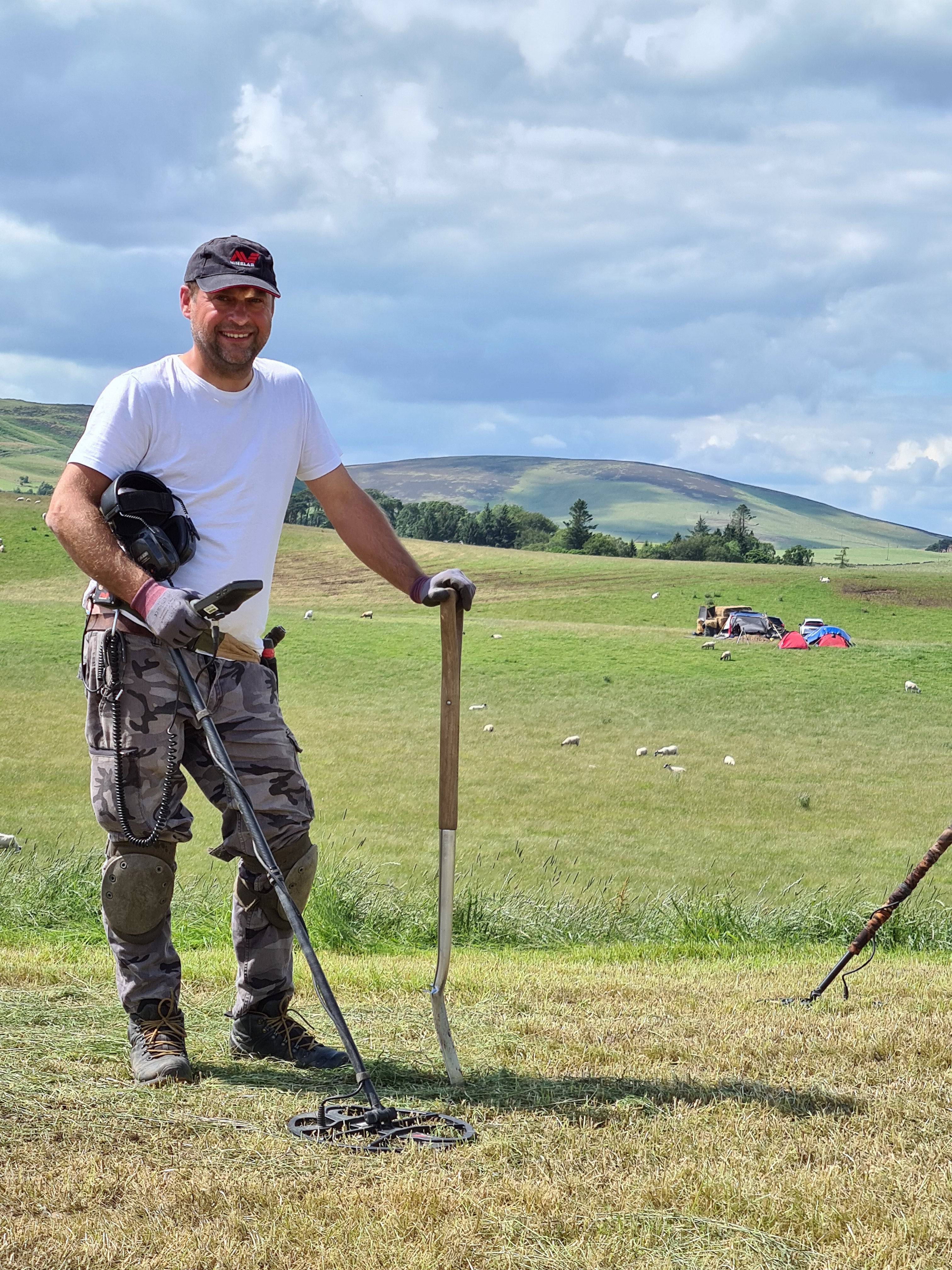 Metal detectorist Mariusz Stepien at an excavation near Peebles, after he found objects believed to be decorative and functional pieces of a Bronze Age harness