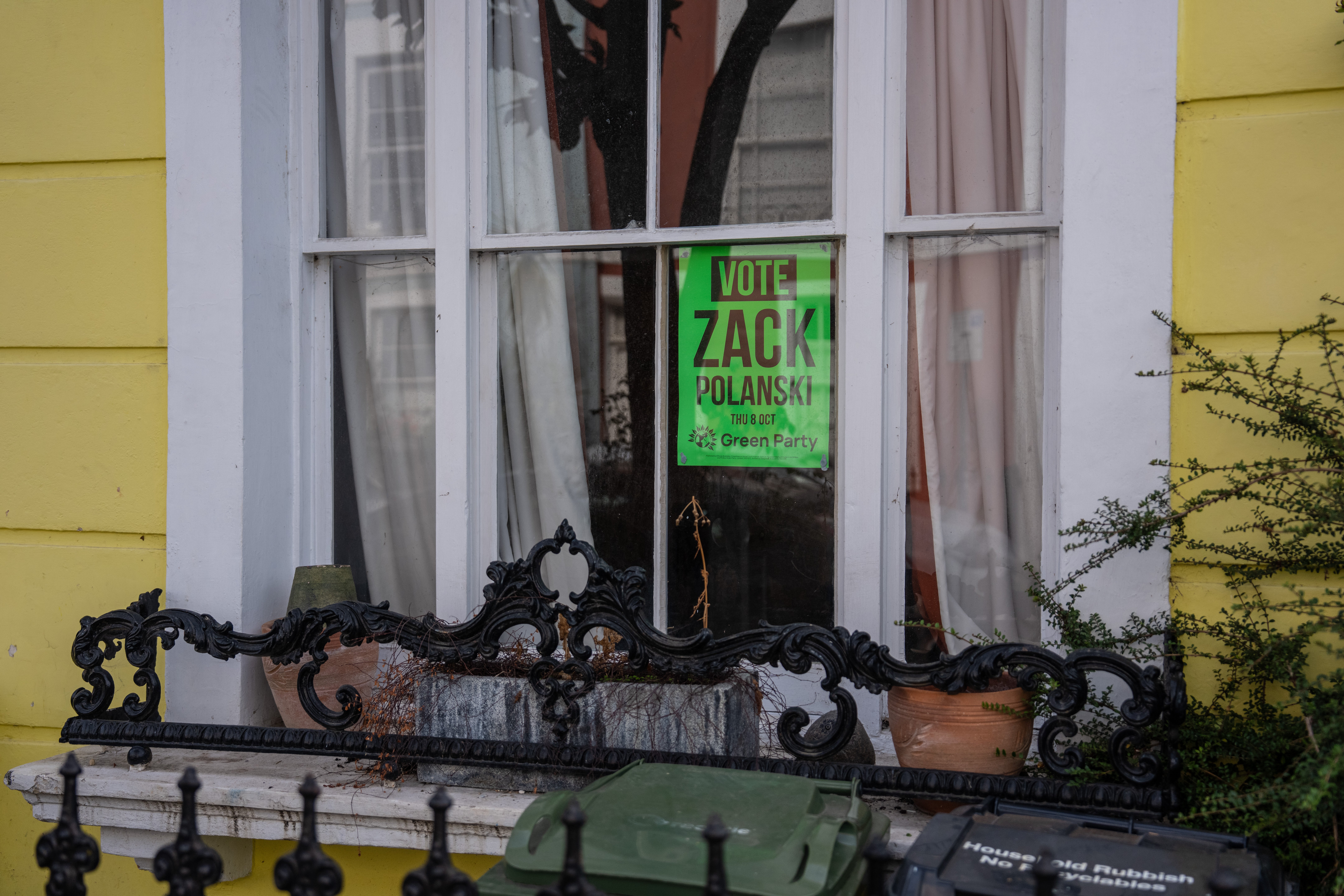 A Green Party flyer is displayed in a house window ahead of the Holborn and St Pancras by-election