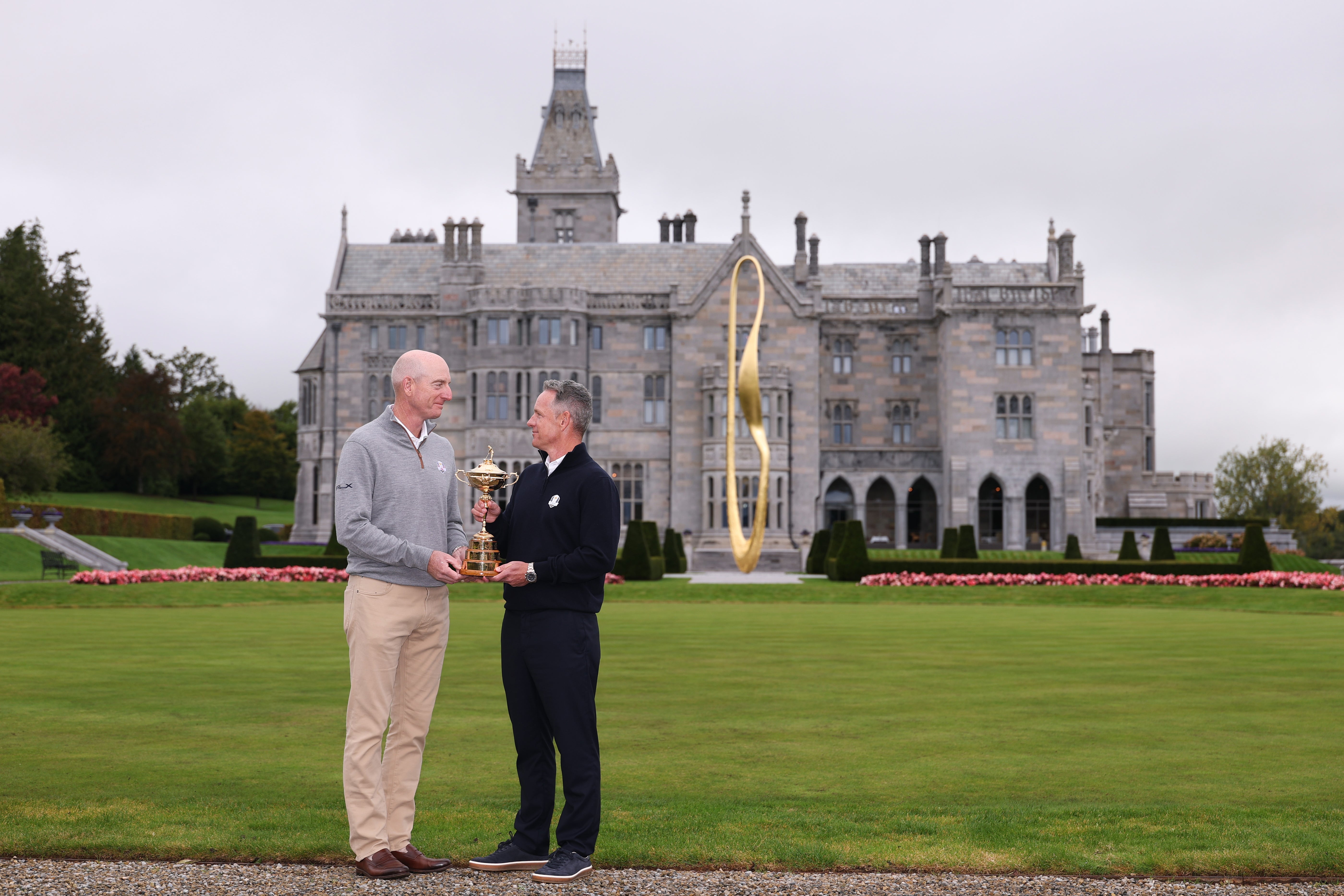 Jim Furyk, Team USA Captain, and Luke Donald, Team Europe Captain, pose for a photograph with the Ryder Cup Trophy