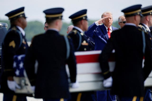 President Donald Trump salutes as members of the military carry the transfer case of U.S. Army Sgt. Angel S. Rampersad of the 1st Battalion, 57th Air Defense Artillery Regiment, 52nd Air Defense Artillery Brigade, 10th Army Air Missile Defense Command, who was killed during an attack at Muwaffaq Salti Air Base in Jordan