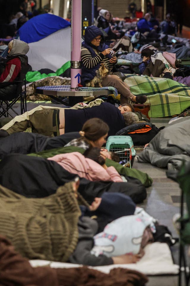 People take shelter inside a metro station during a Russian missile strike, amid Russia's attack on Ukraine, in Kyiv, Ukraine