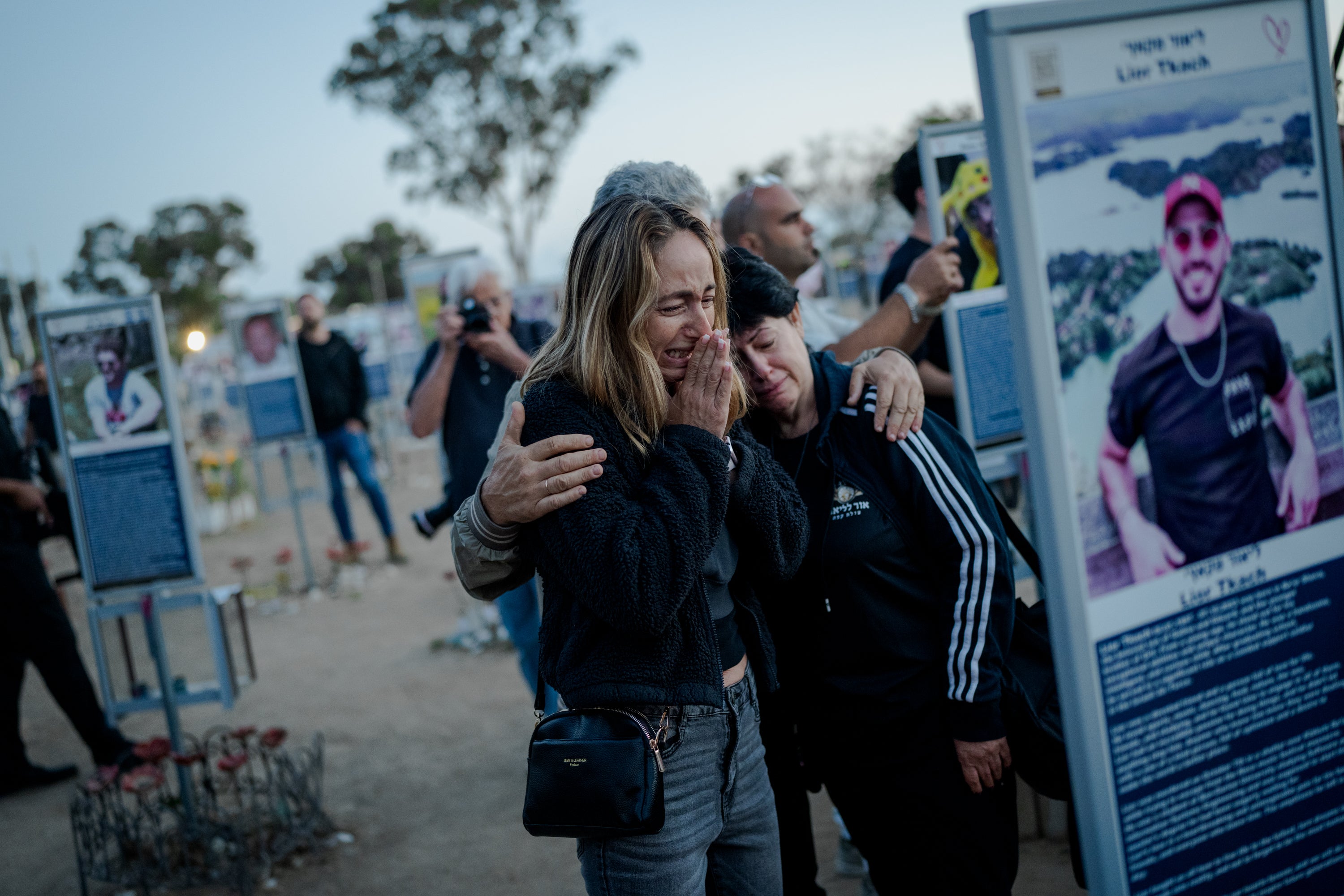 Women crying at a memorial for the October 7 attack in Israel