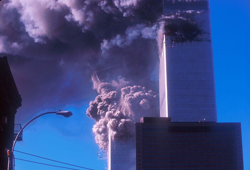 One of the World Trade Center's twin towers collapses after it was struck by a commerical airliner in a suspected terrorist attack September 11, 2001 in New York City