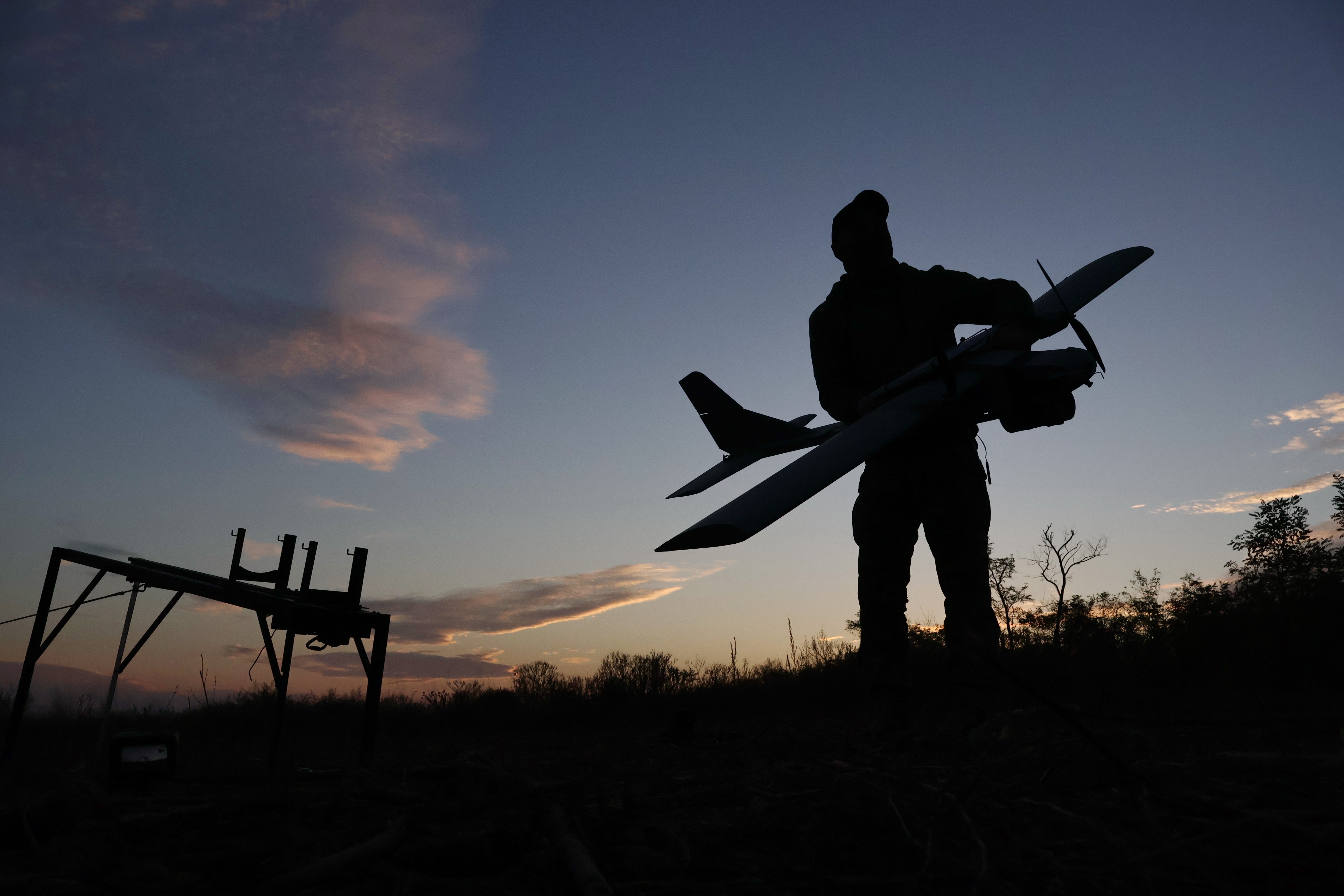 A Ukrainian serviceman launches a drone towards Russian positions at the front line in the Zaporizhzhia region, Ukraine, Wednesday Oct. 7, 2026