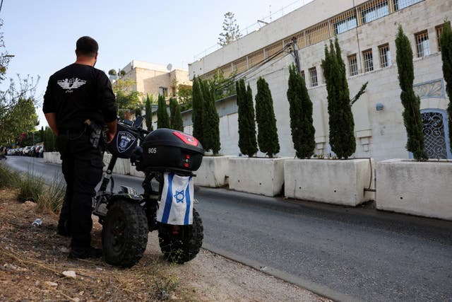 A member of Jerusalem Municipality stands outside the British consulate on the deadline set by Israel for its closure, following trade sanctions imposed by British Prime Minister Andy Burnham on Israeli settlements in the occupied West Bank, in East Jerusalem, October 8, 2026.