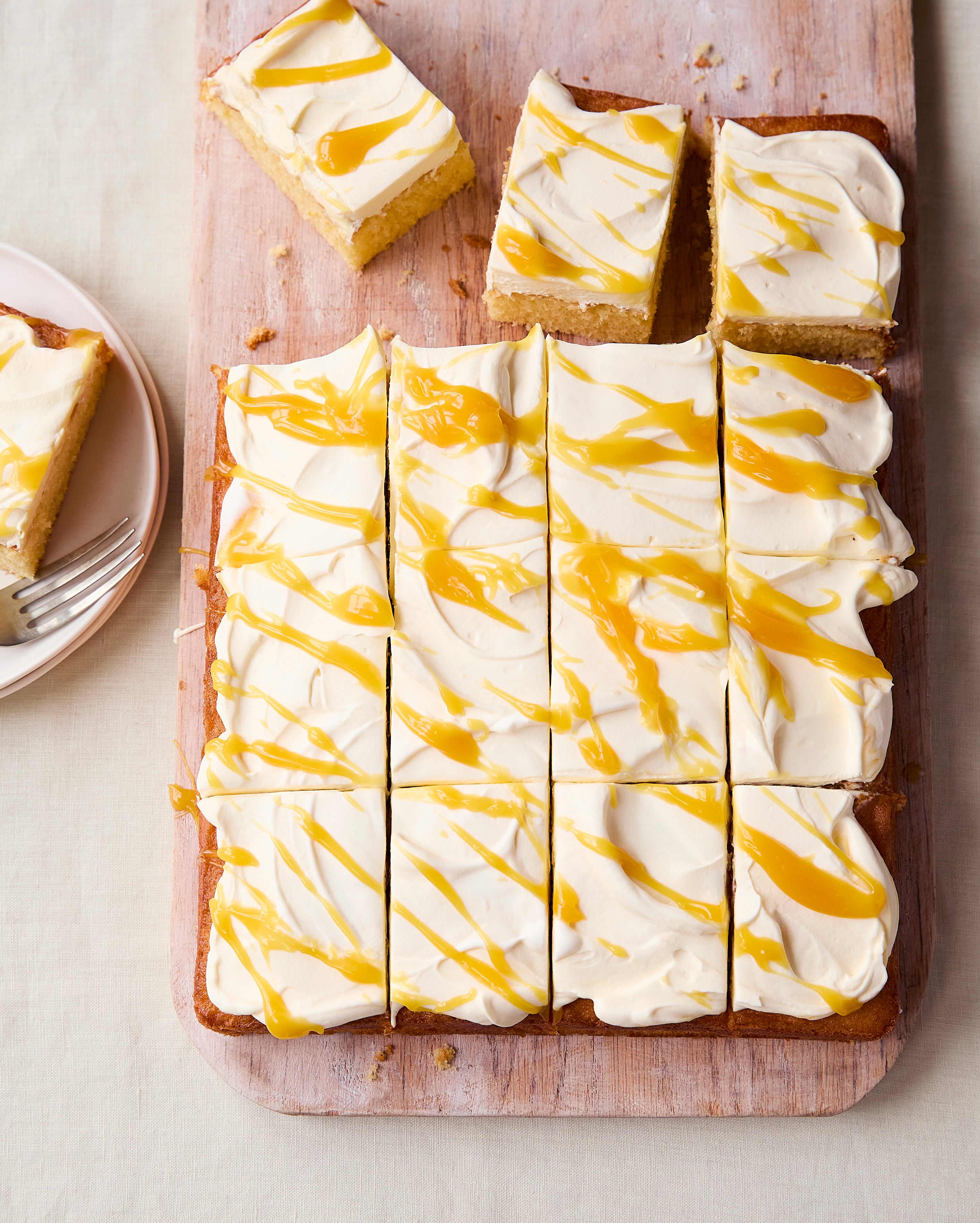 A light lemon sponge topped with passion fruit cream makes this easy traybake perfect for sharing
