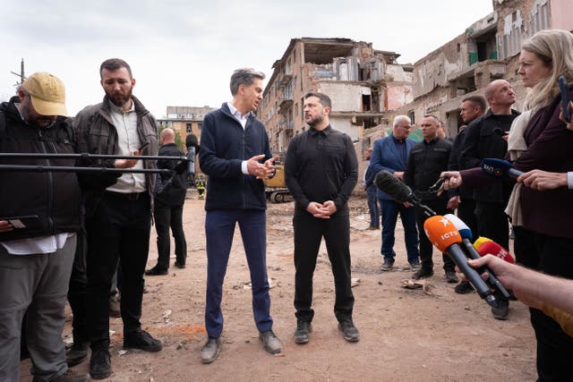 Foreign Secretary Ed Miliband and Ukrainian President Volodymyr Zelensky speak to the media during a visit to the site of a Russian missile strike which hit a residential area in Pryluky, northern Ukraine, where 22 people, including five children, were killed on October 6. Picture date: Thursday October 8, 2026.