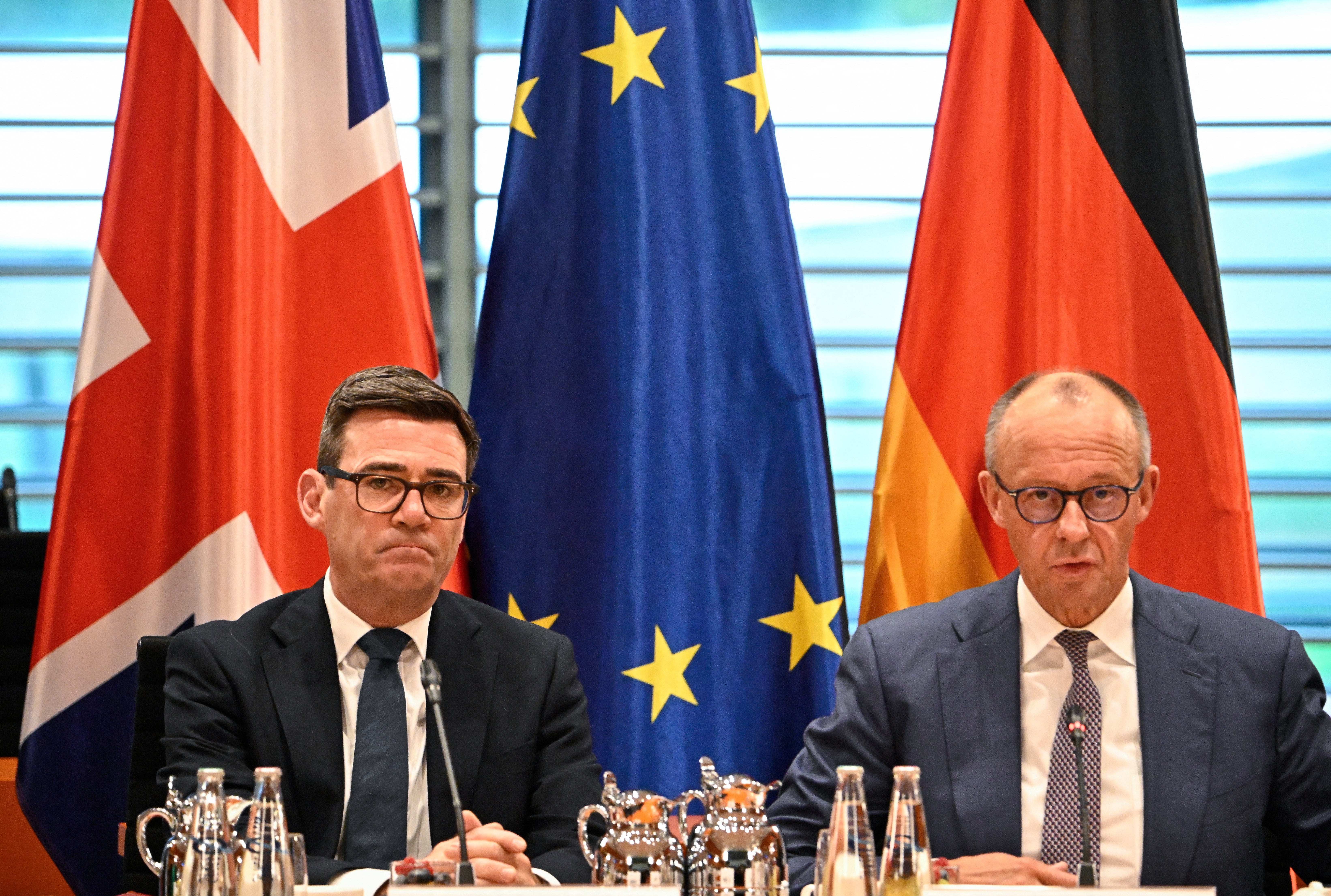 Mr Burnham, pictured here with the German chancellor earlier this week, has gone far further than his predecessor when it comes to Britain’s relationship with Europe