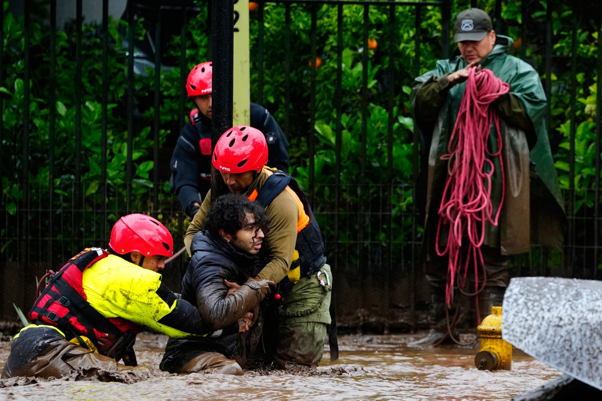 Heavy rain batters Chile’s capital, sweeping away cars and flooding homes