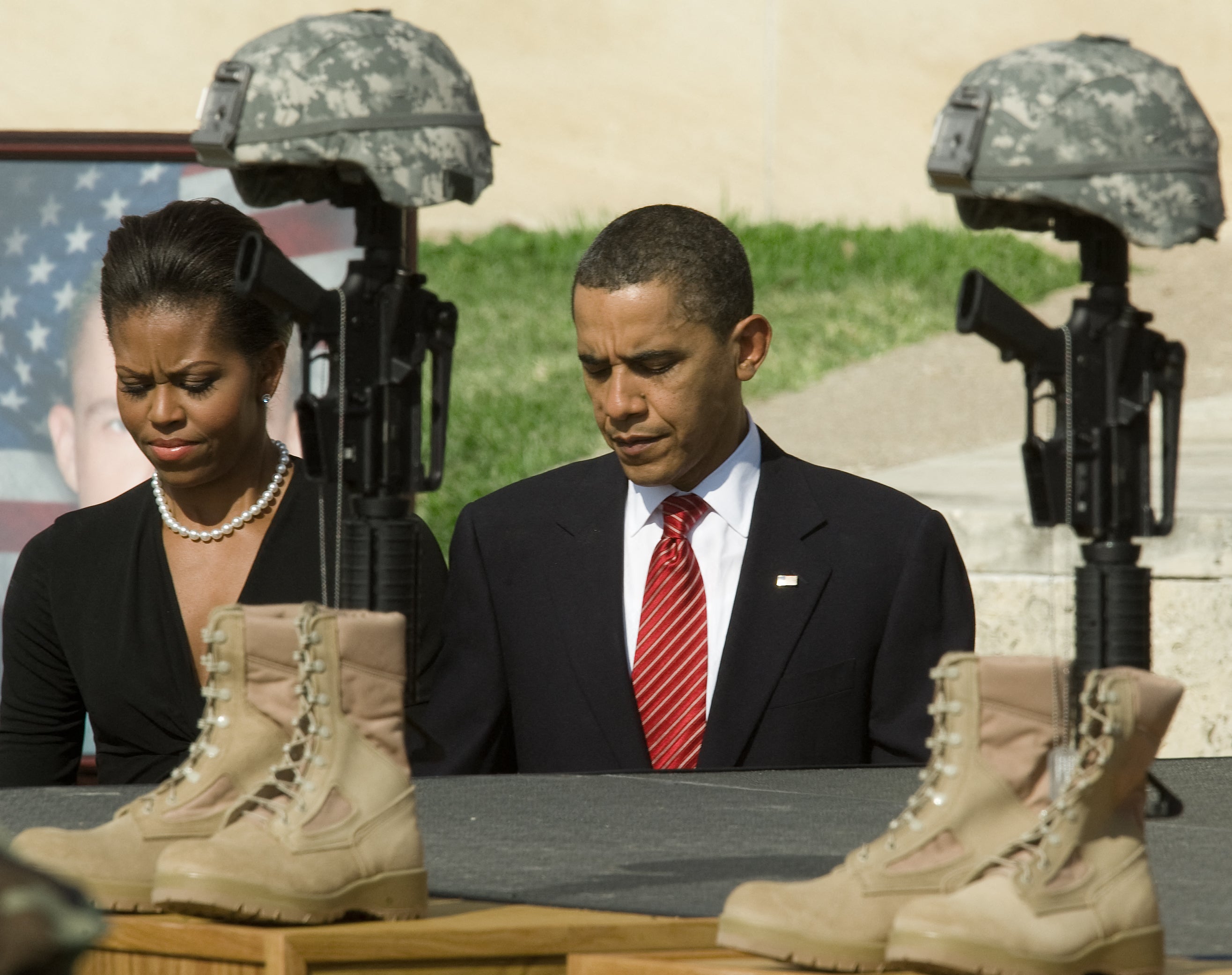 US First Lady Michelle Obama and President Obama walk past the Fallen Hero Memorial at Fort Hood on November 10, 2009