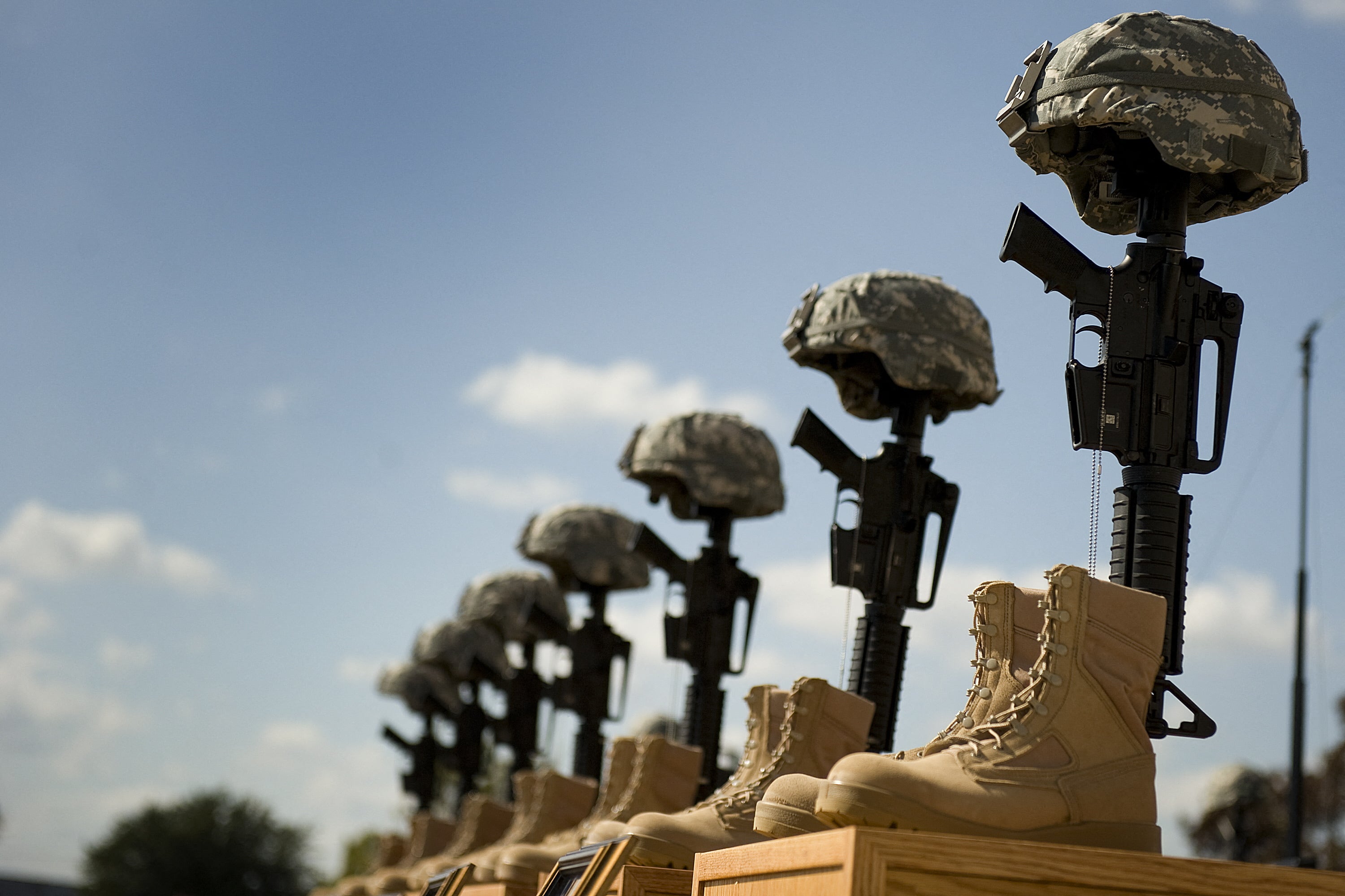 A fallen soldiers memorial is seen in front of the podium where the memorial service that US President Barack Obama and first lady Michelle Obama will attend for the thirteen victims of the shooting rampage by US Army Major Nidal Malik Hasan on November 10, 2009 in Fort Hood, Texas