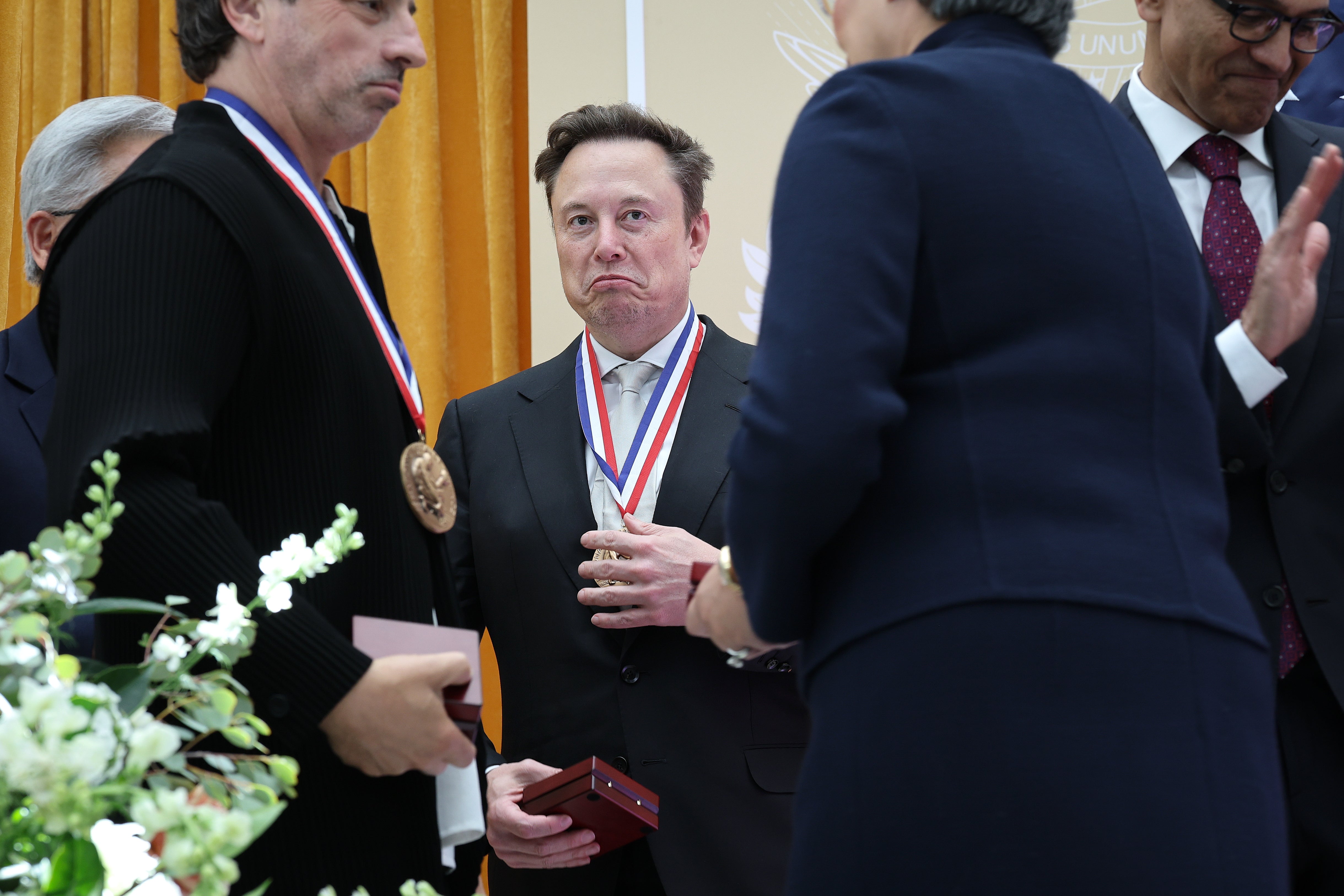 Co-founder of Google and former President of Alphabet Sergey Brin, U.S. President Donald Trump and Nvidia CEO Jensen Huang point to guests in the crowd during the Golden Age of American Innovation Summit at the Institute of Peace on October 08, 2026 in Washington, DC