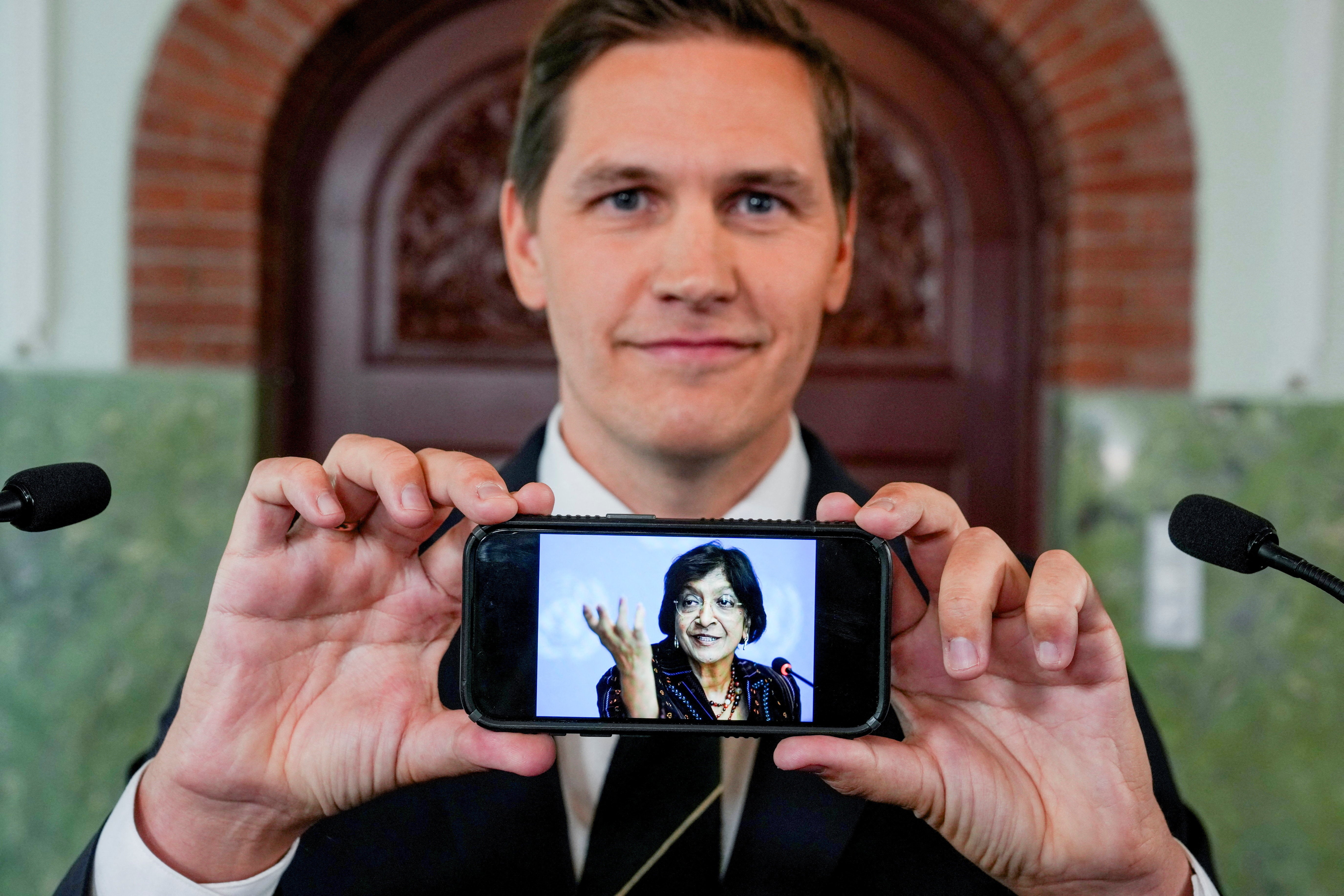 Chair of the Norwegian Nobel Committee Jorgen Watne Frydnes shows a photo of Navanethem ‘Navi’ Pillay