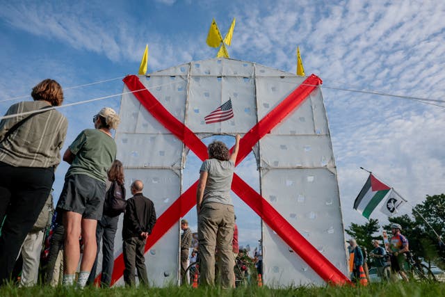 Just days before Arlington County, Virginia, filed the lawsuit, demonstrators protested Trump’s proposed triumphal arch at its planned site in Memorial Circle in Washington, D.C.