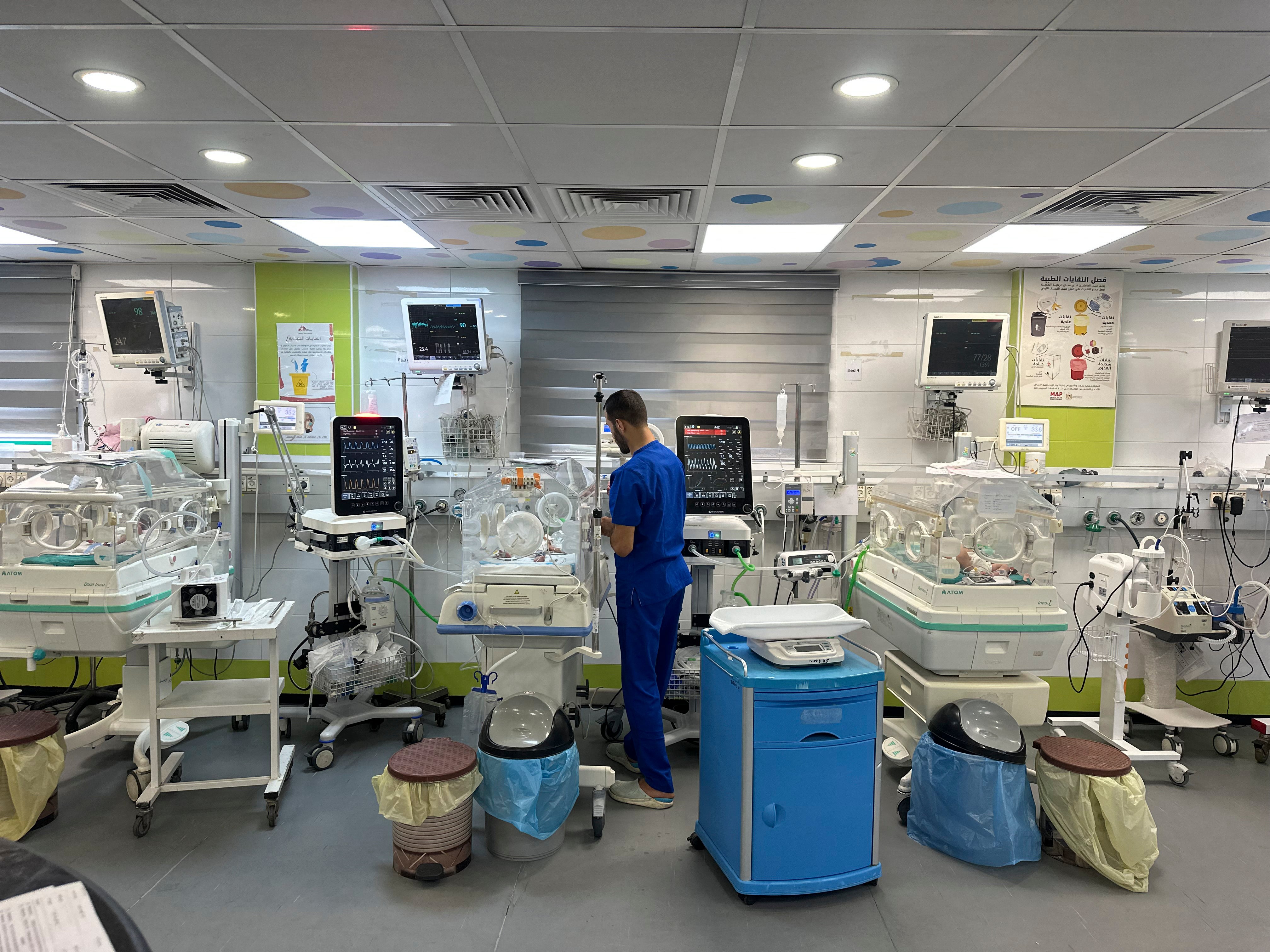 A medical worker attends to newborns surrounded by neonatal equipment at Nasser Medical Complex in Khan Yunis, southern Gaza Strip, on September 26, 2026.