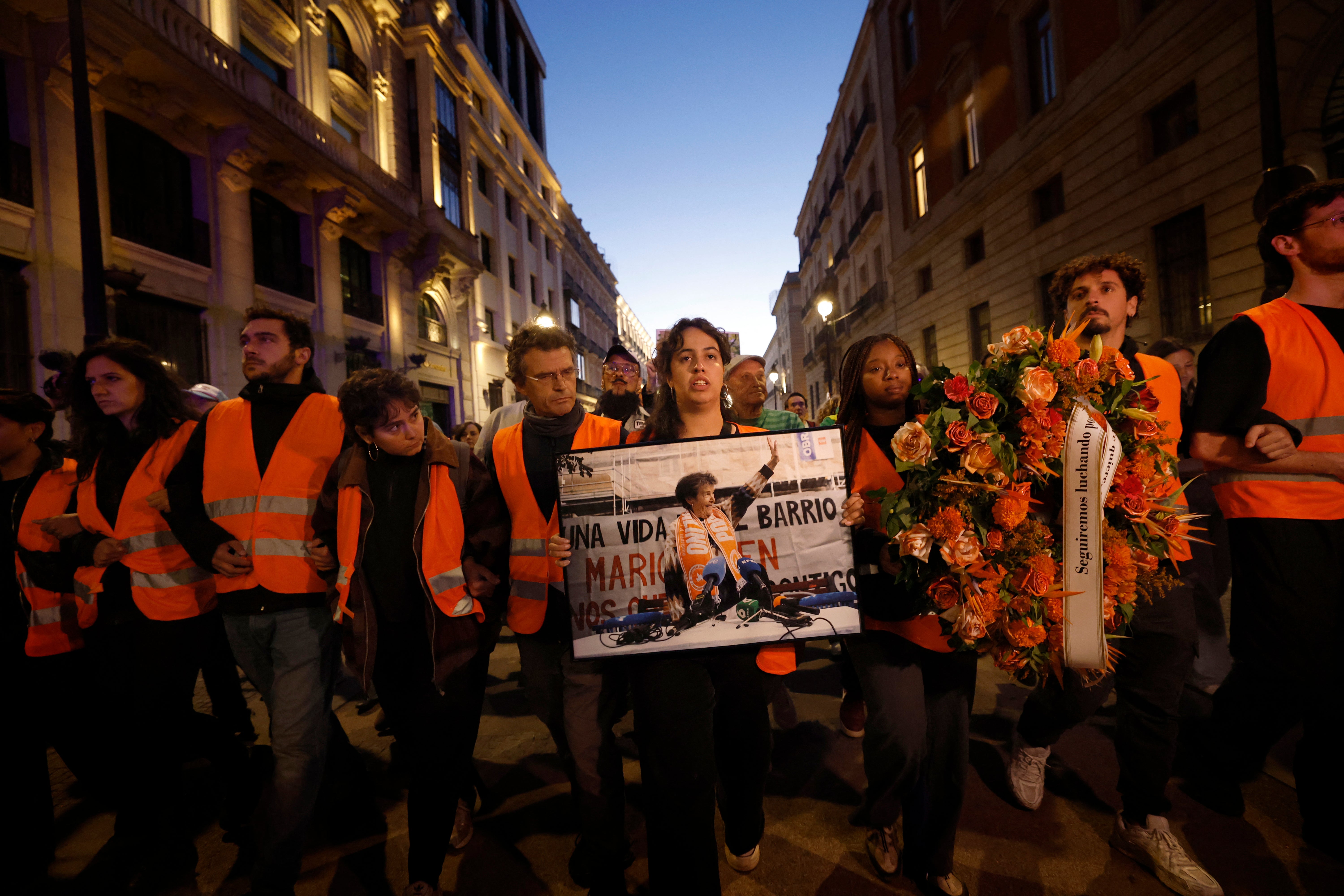 Thousands of Spaniards marched through central Madrid on Thursday to mark the death of the 87-year-old woman whose eviction from her home ignited protests across the country and led to a snap election next month